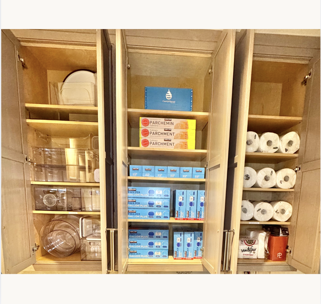 Organized kitchen pantry with categorized shelving and storage containers — professional pantry organization by Ordered Living Co. Austin TX