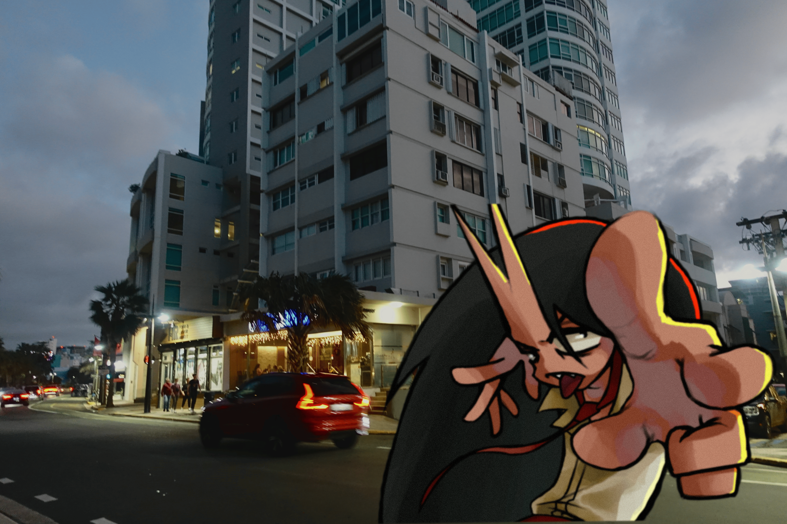 A city street scene at dusk with a large apartment building in the background, cars on the road, and a small group of people standing outside a lit storefront. An animated cartoon character with black hair, a red outline, and cat-like features is superimposed in the foreground, making a gesture towards the camera with a playful expression.