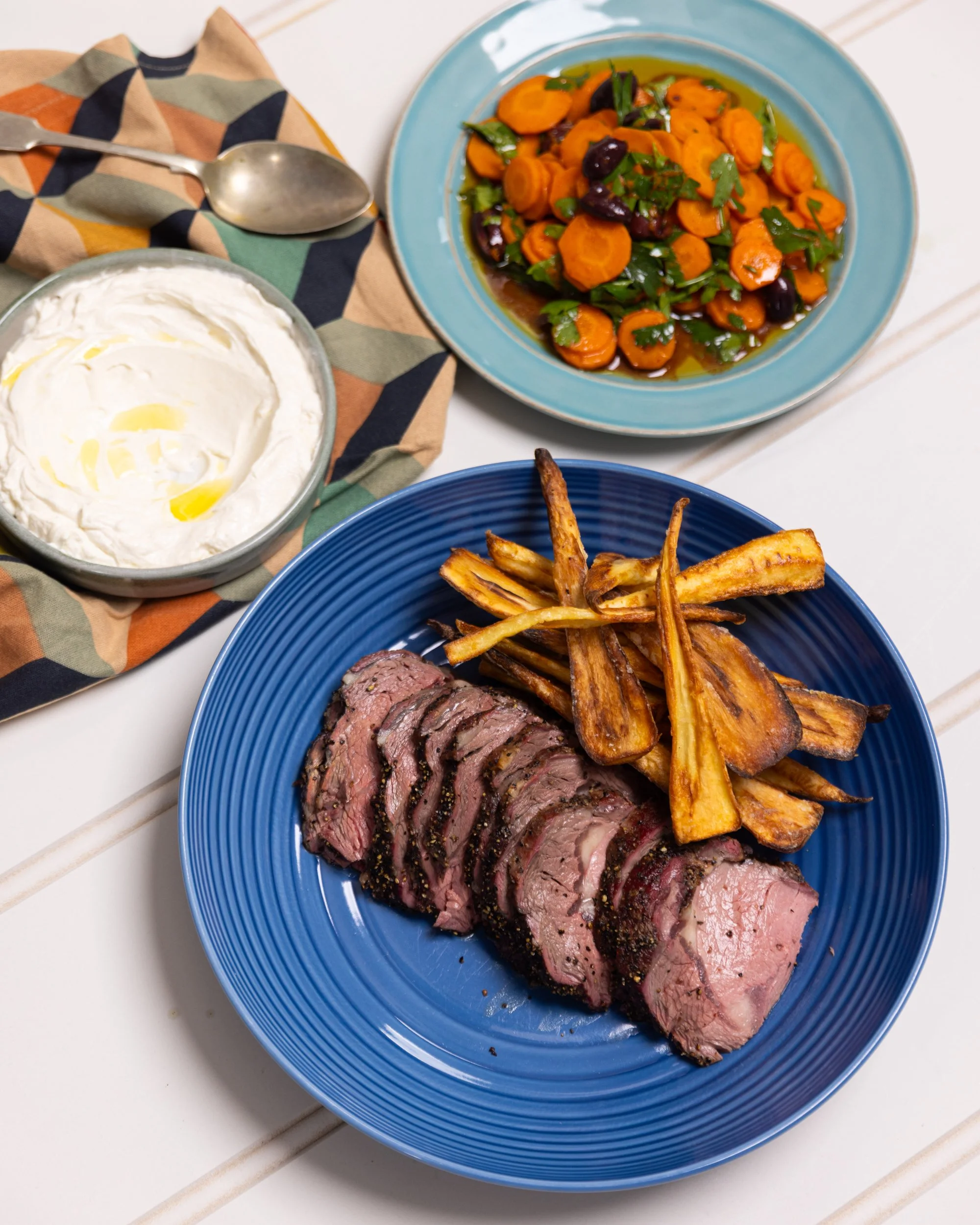 Shaved Scotch Fillet, Tahini Yoghurt, cooked Carrot & Olive Salad, Orange zest, roast Parsnip chips