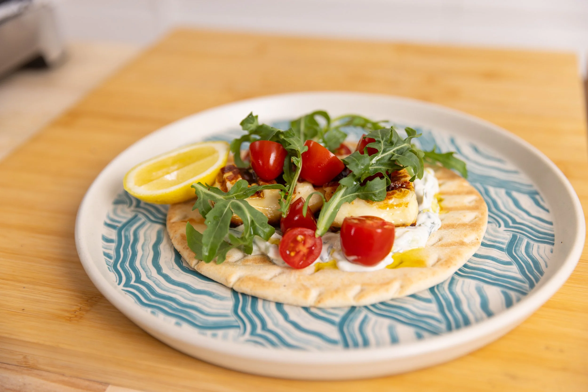 Open Pita, with grilled Cyprus Style Haloumi, Tzatziki, Vine Tomatoes, Hot Honey