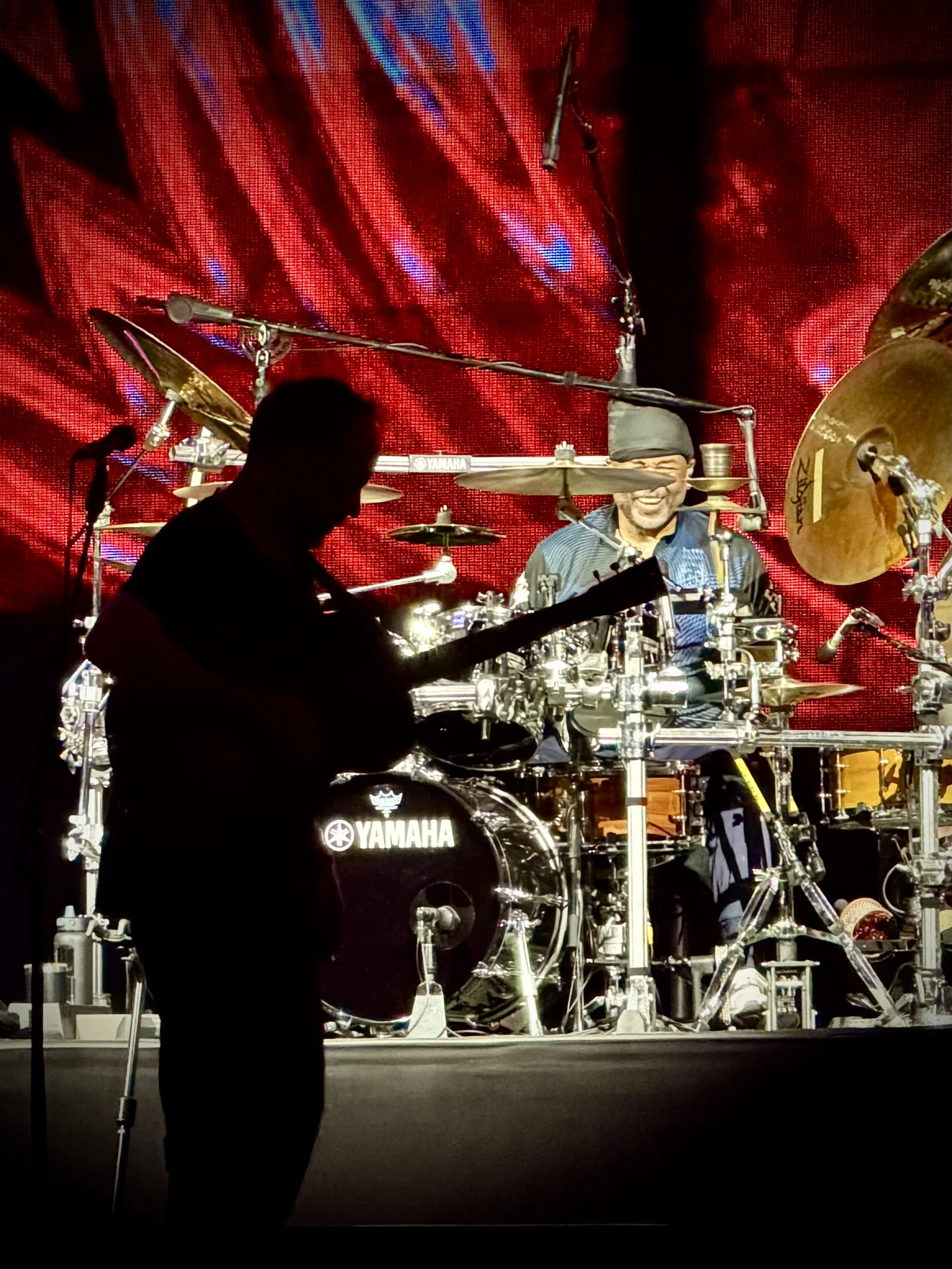 Carter Beauford and the silhouette of Dave Matthews, Tampa, 2026