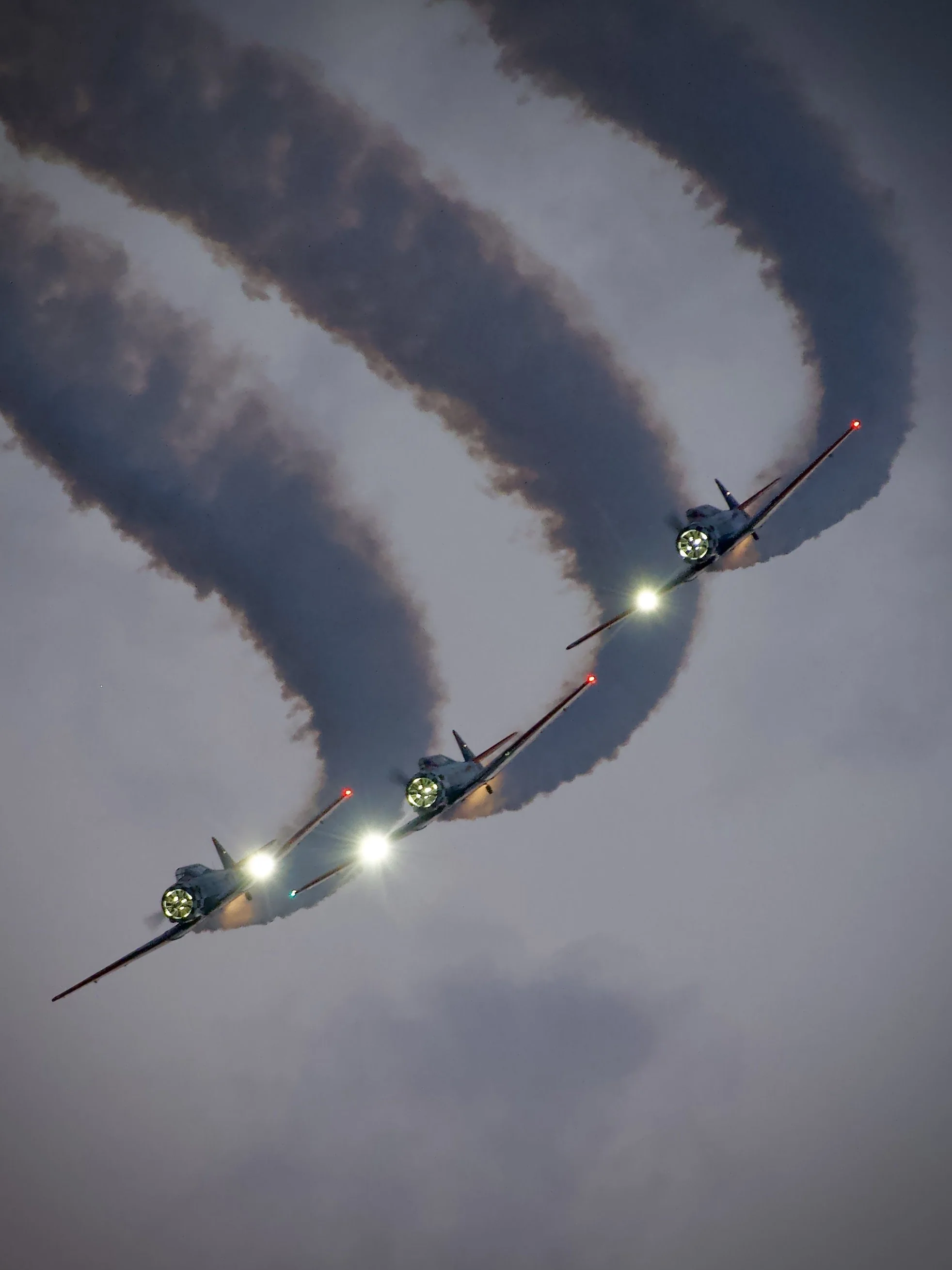 TITAN Aerobatic Team T-6 Texans after sunset