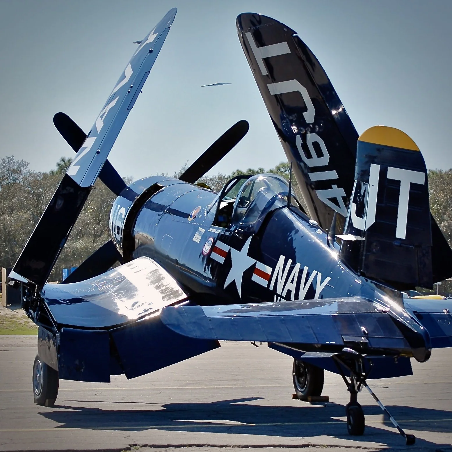 B-2 Spirit bomber inbound over an F-4U Corsair