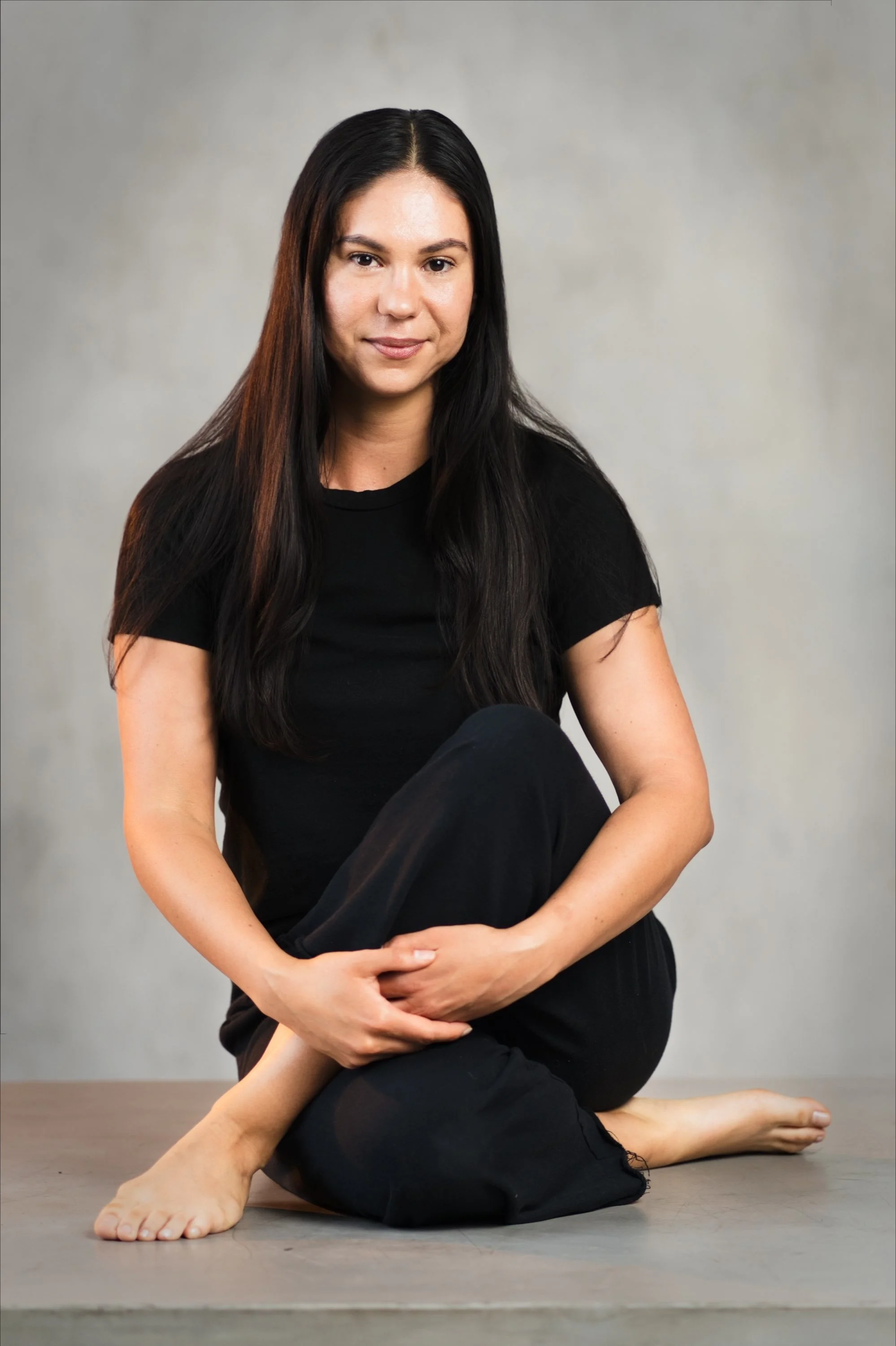 Portrait of a woman seated.