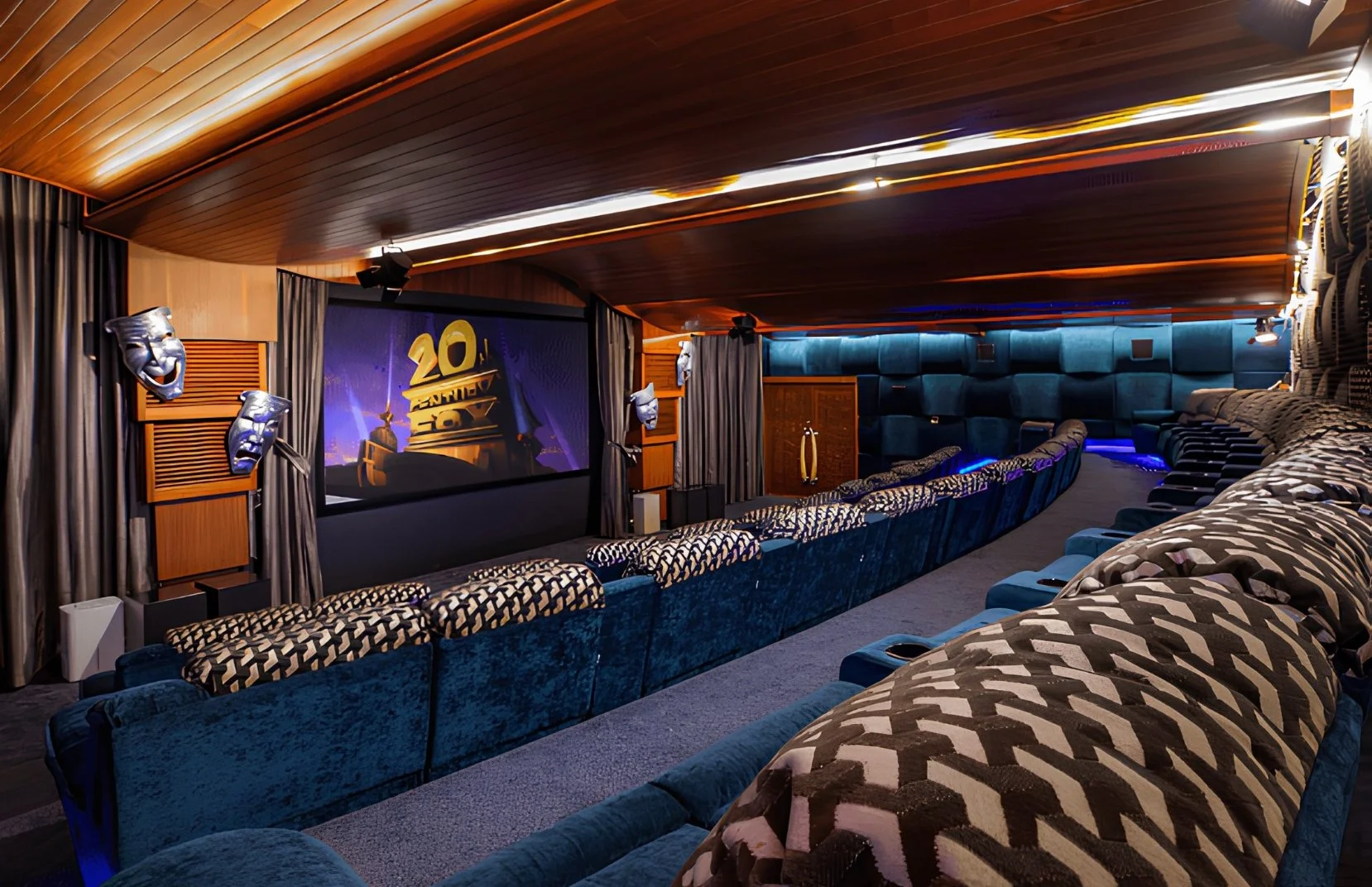 Luxurious movie theater with plush blue seating, decorative masks, and a screen displaying the number 20 with a golden Oscar statue in the background.