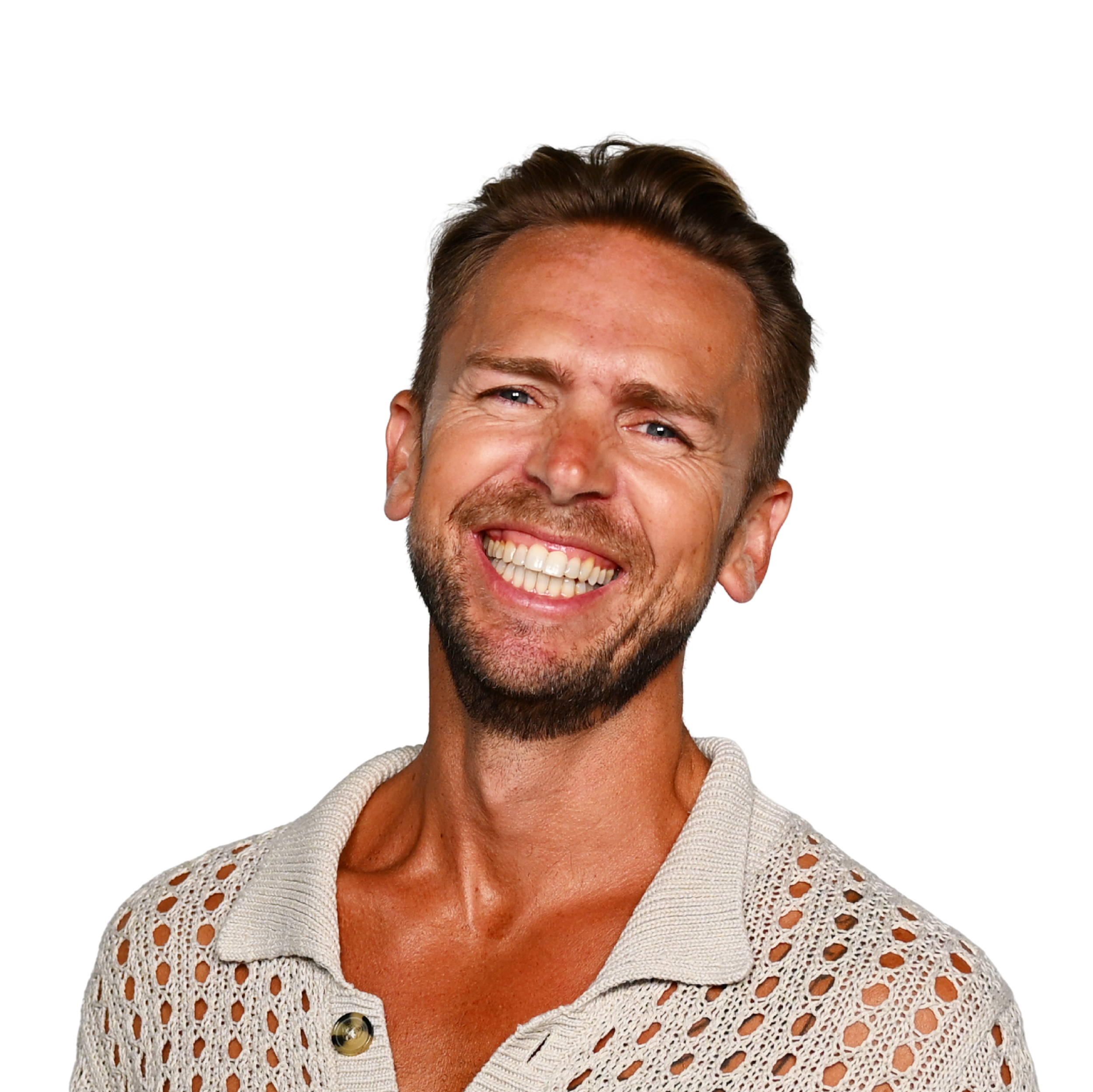Smiling man with short brown hair, beard, and blue eyes, wearing a beige crochet top.