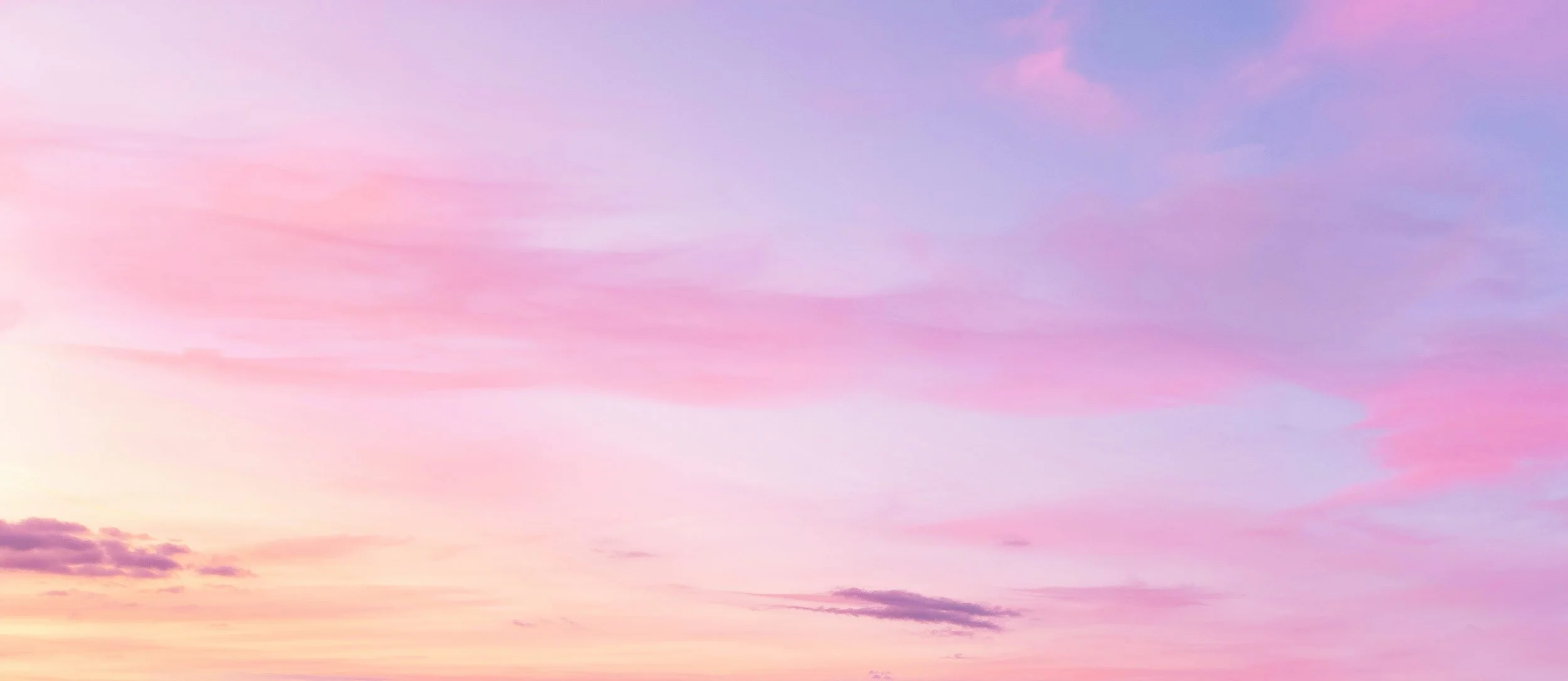 Colorful sky with shades of pink, purple, and orange during sunset or sunrise.
