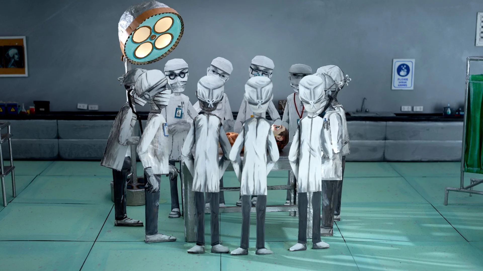 A group of drawn doctor puppets gathered around a table in an operating room, performing surgery on a patient with an ocean scene visible through a window in the background. Film still from If/When short film.