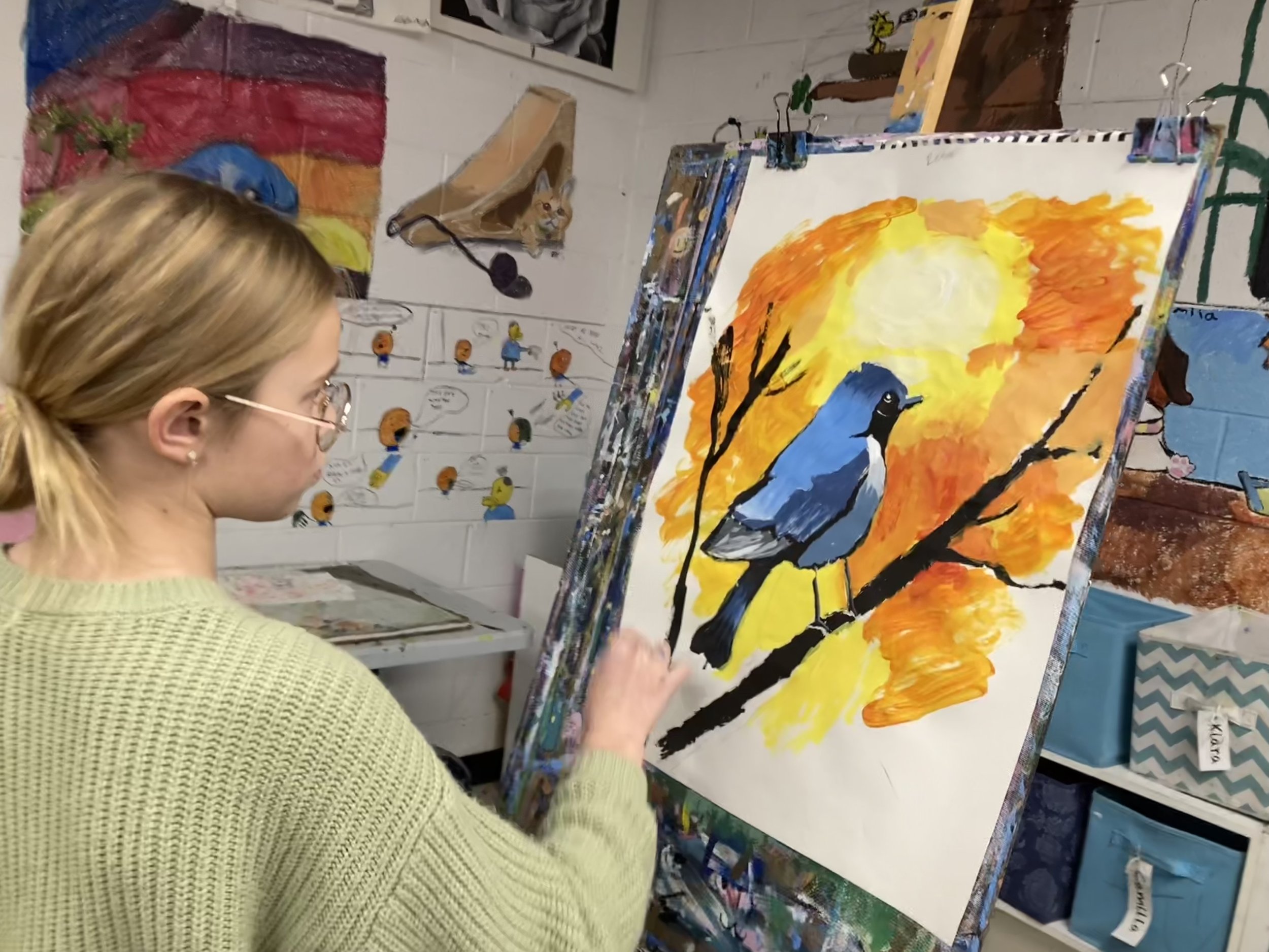 renee painting her bird.jpeg