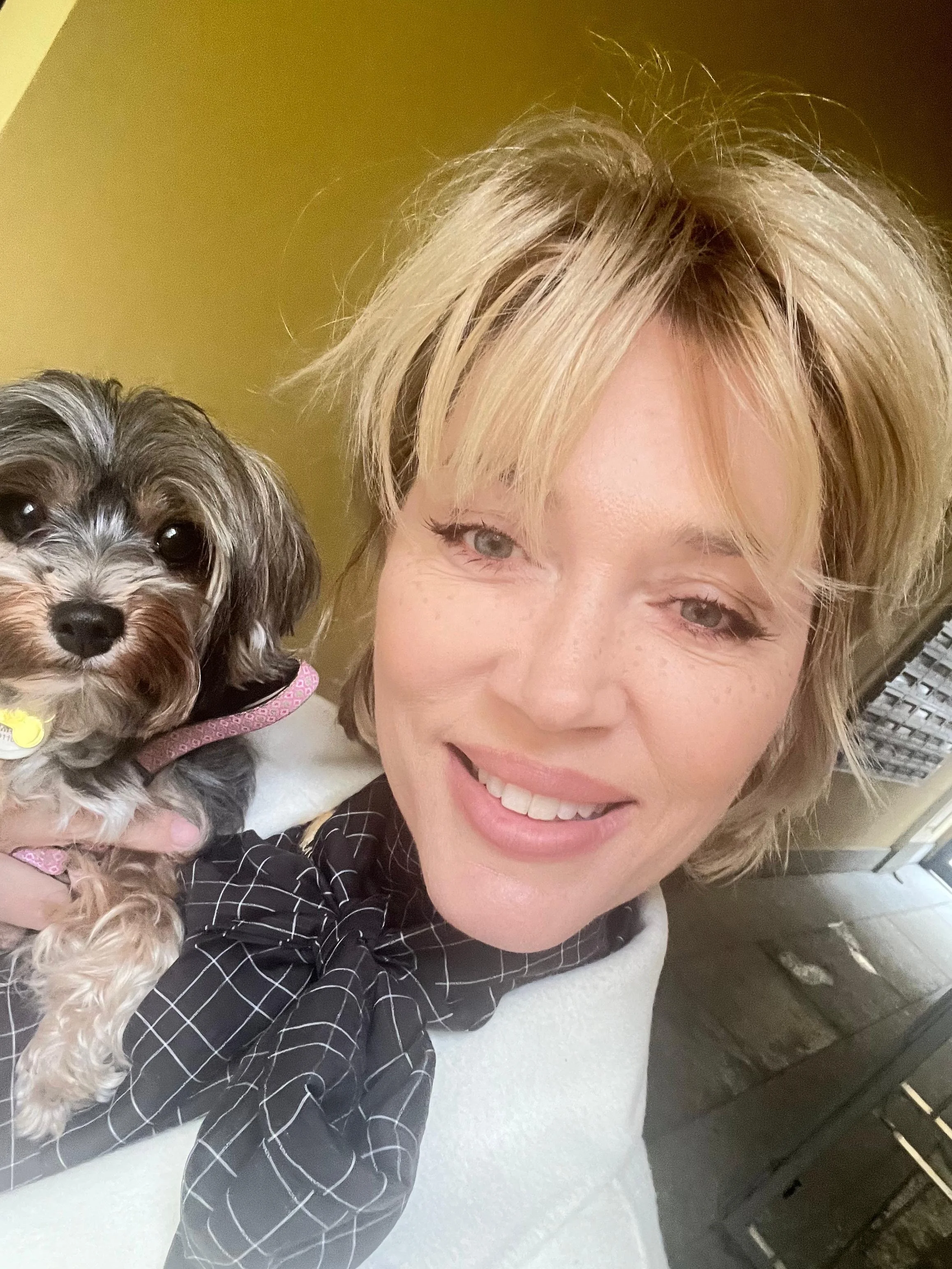 woman with cute dog smiling, milan image consultant