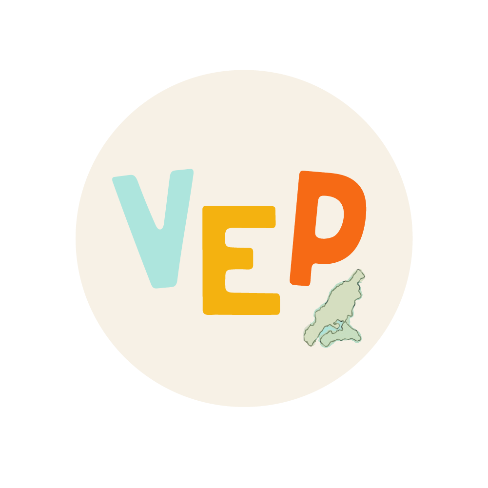 The image features the letters 'V', 'E', and 'P' in pastel and vibrant colors, with a small map outline of Vashon Island at the bottom right within a white circle.