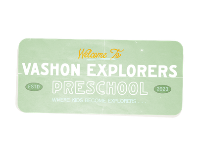 The signboard reads "Welcome to Vashon Explorers Preschool" with the tagline "Where Kids Become Explorers" and the year 2023. The design features a light mint green background and white text.
