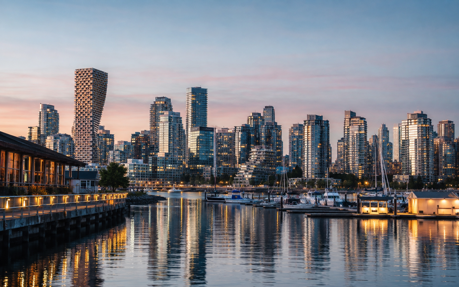 Downtown Vancouver, British Columbia skyline with modern glass towers, waterfront views, and mountains in the background, photographed at twilight for Mr. Marble and Stone.