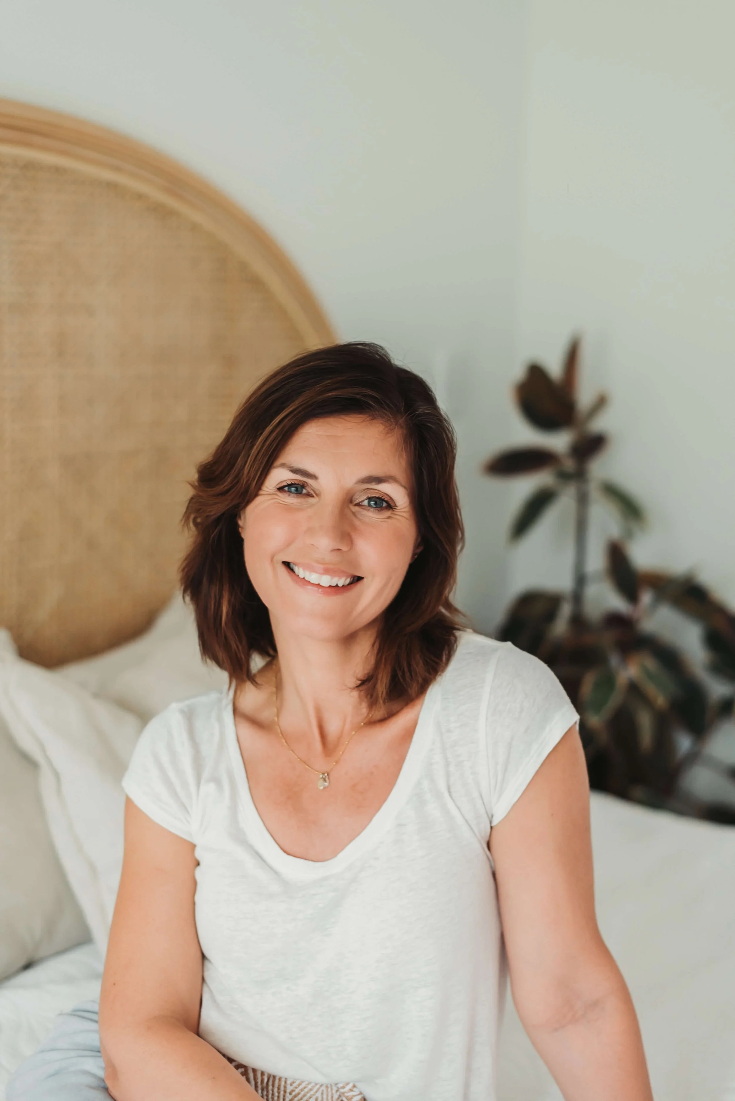 Heather Ferry smiling warmly wearing a white top in a comfortable setting