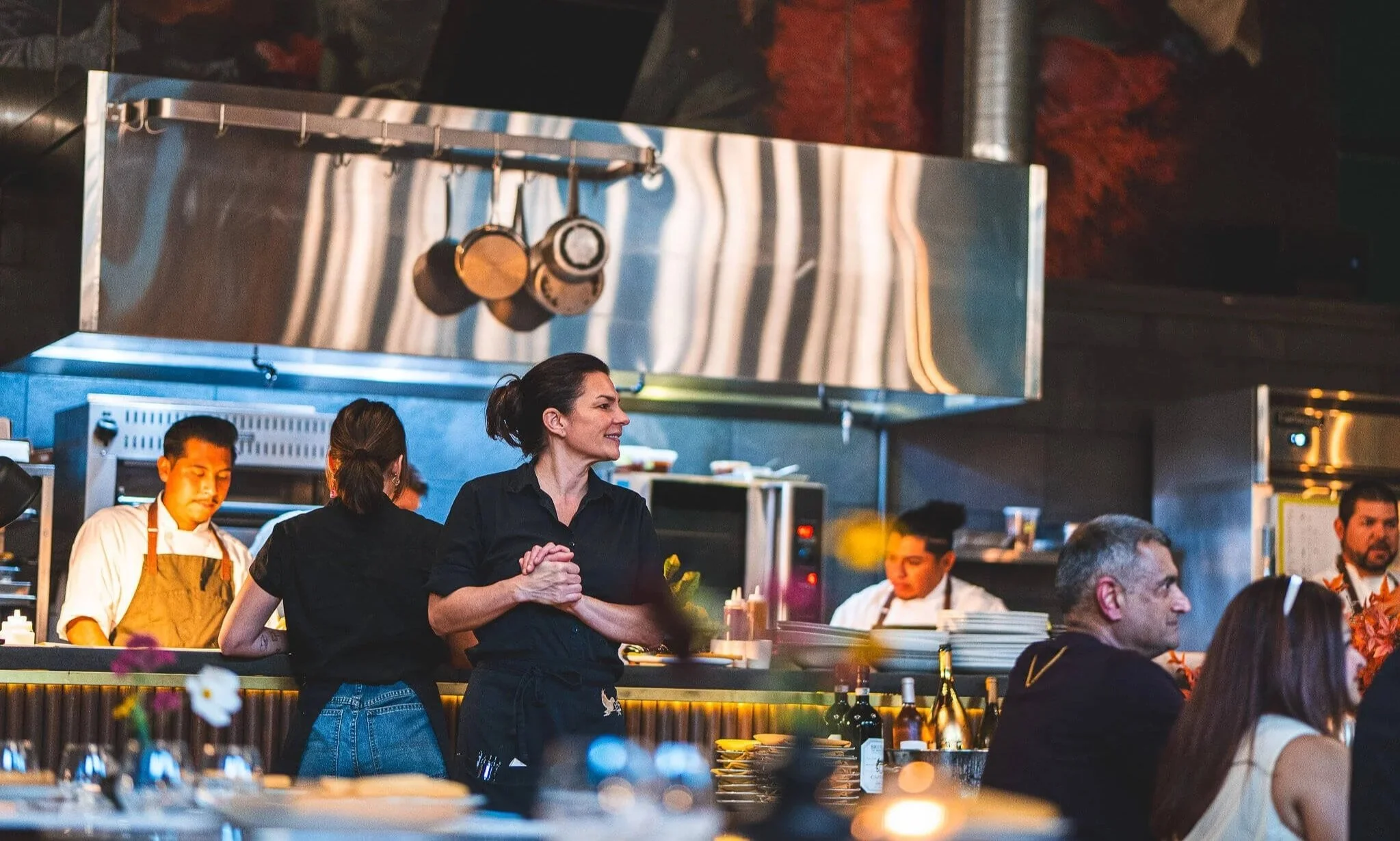 Hospitality team working in a lively restaurant kitchen in Sonoma, California