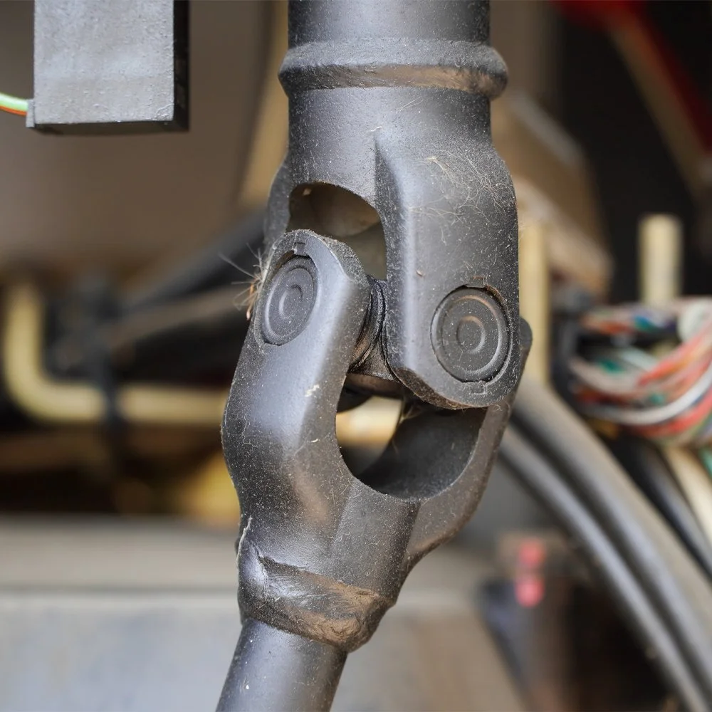 Heavy-duty universal joint connecting a driveshaft within a commercial vehicle driveline system.