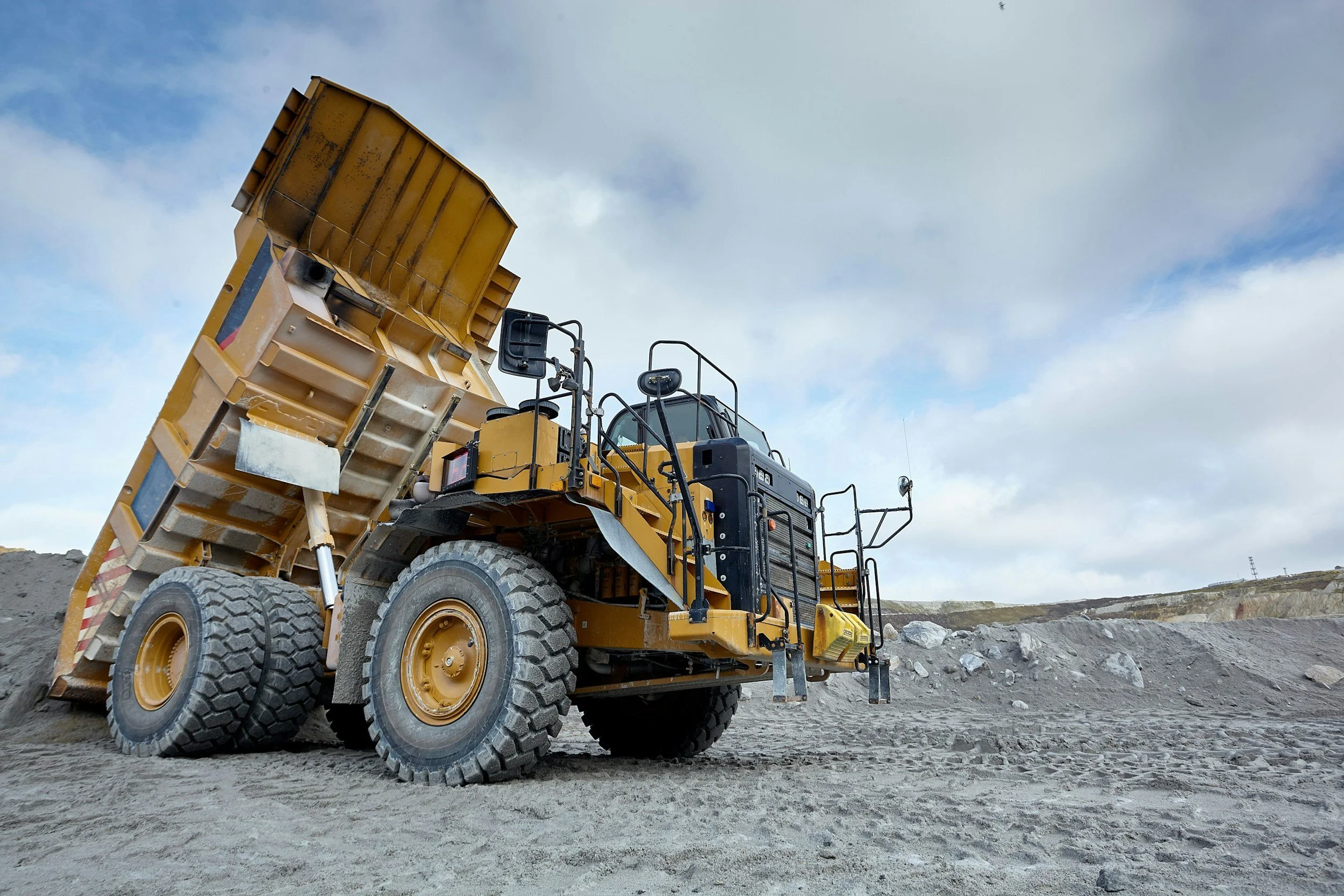 Heavy-duty mining dump truck showcasing industrial driveline products, propshaft components, heavy equipment components, and high-performance driveline systems used in demanding industrial applications