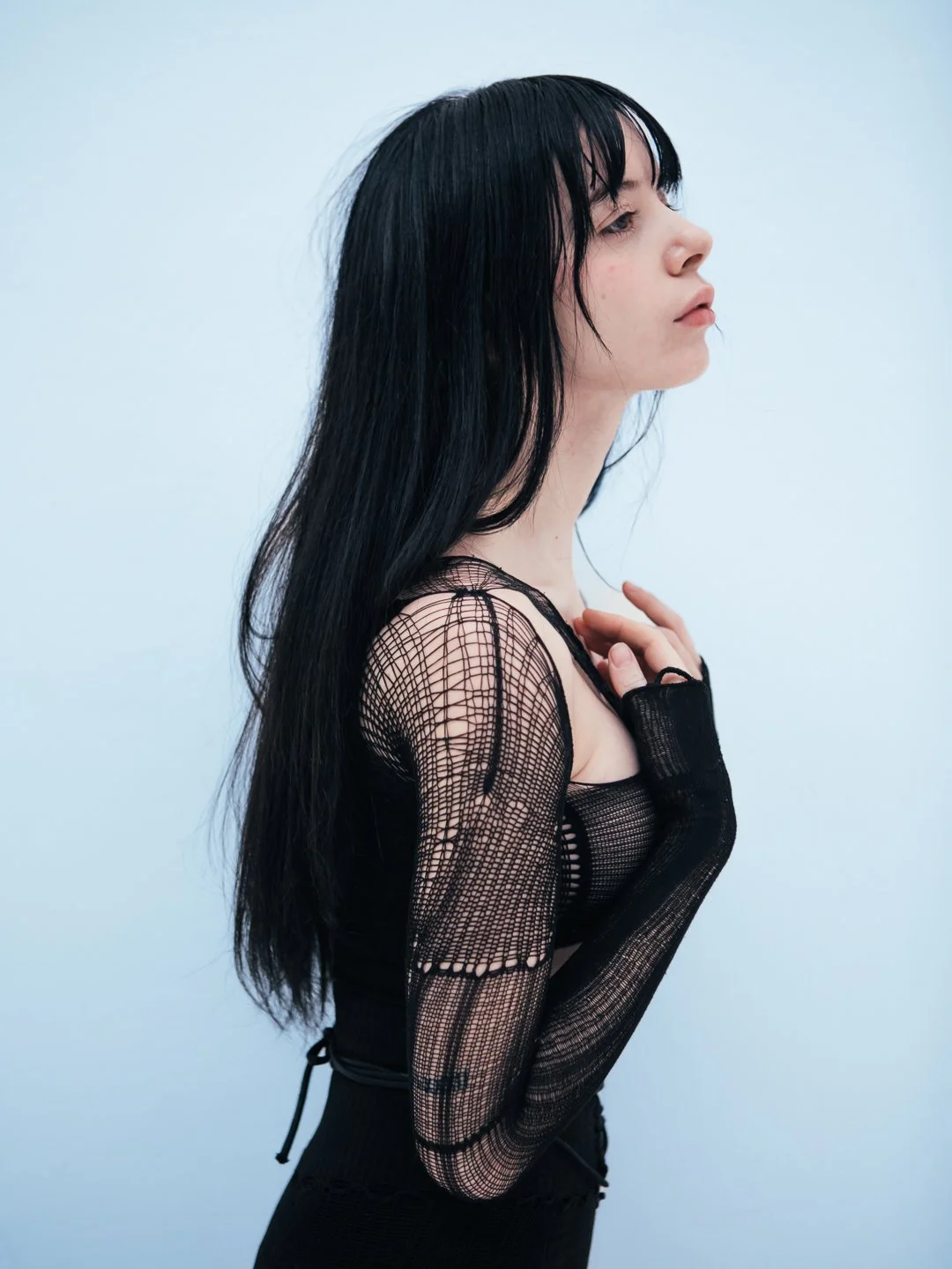 Model in a black avant-garde VOFT knit shapewear bodysuit by Valeriya Olkhova, made in Odder, Denmark at Apotheca Atelier. Styled by Anca Macavei for Nasty Magazine Italy. Luxury lingerie for expressive women.