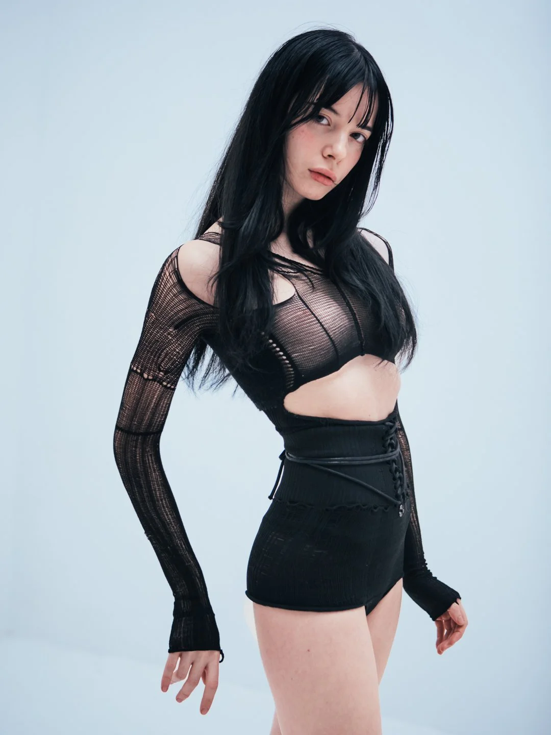 Model wearing a black lycra VOFT bodysuit by Valeriya Olkhova, futuristic knit, ultra lightweight  in Denmark, Odder at Apotheca Atelier. Styled by Anca for Nasty Magazine Italy.