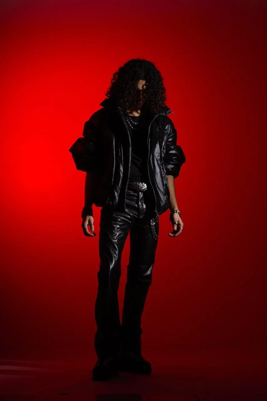 Model wearing handmade black leather trousers crafted at Apotheca Atelier in Odder, Denmark. Featuring a sleek fit, tactile finish and a refined, avant-garde approach to leather tailoring