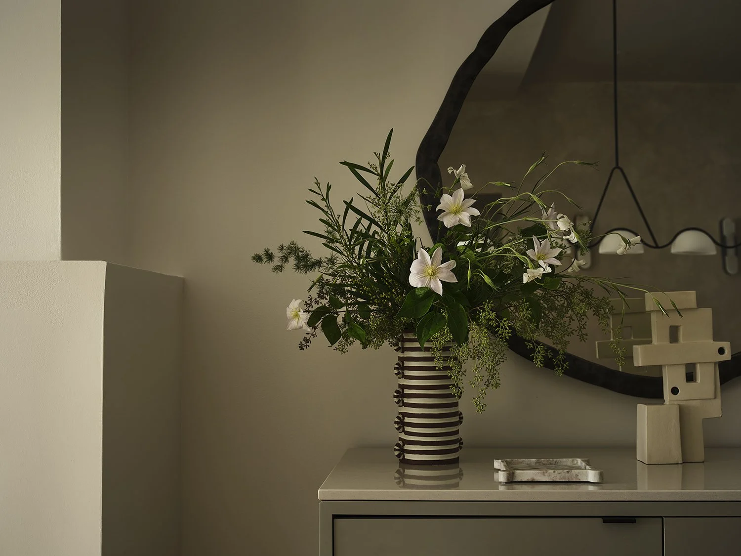 Interior styling detail in a Brooklyn townhouse by Vanessa Katzen, featuring sculptural objects and layered textures, photographed by Frank Frances.