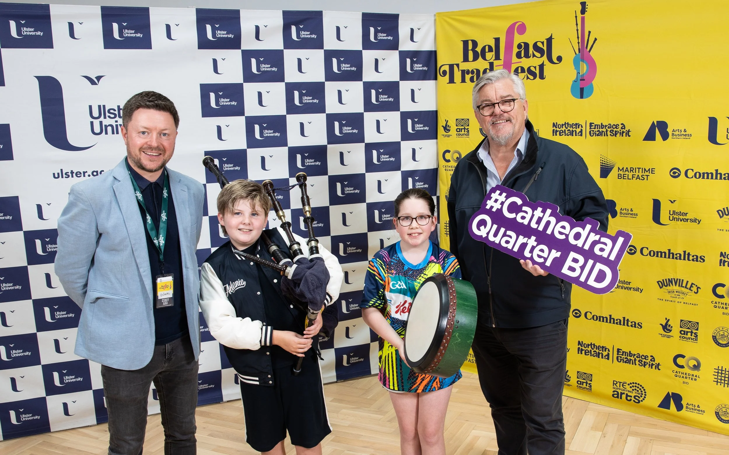 Artistic Director Dónal O'Connor and Damien Corr of Cathedral Quarter BID with bursary recipients Alexander Jackson and Orla Reynolds.jpg