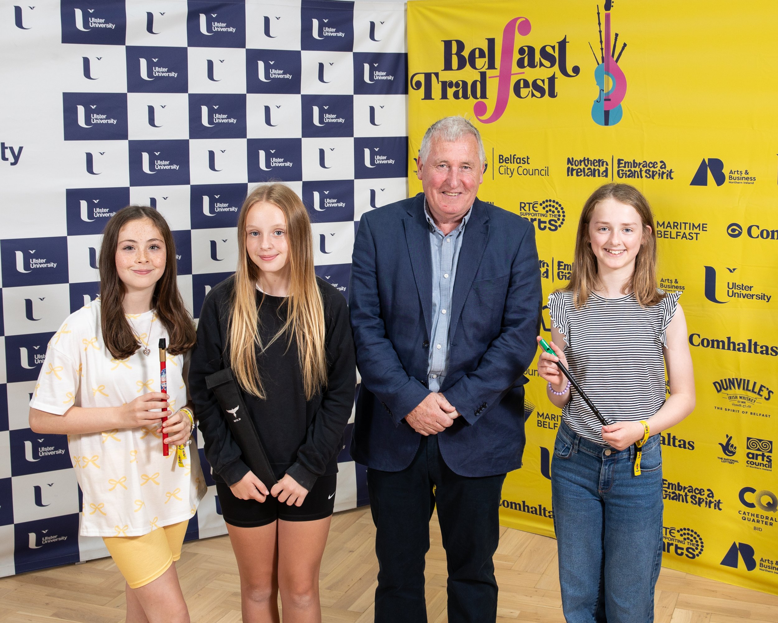 Paul Darby with bursary recipients Luisne Níleannáin, Ava Campbell and Zara O'Reilly.jpg