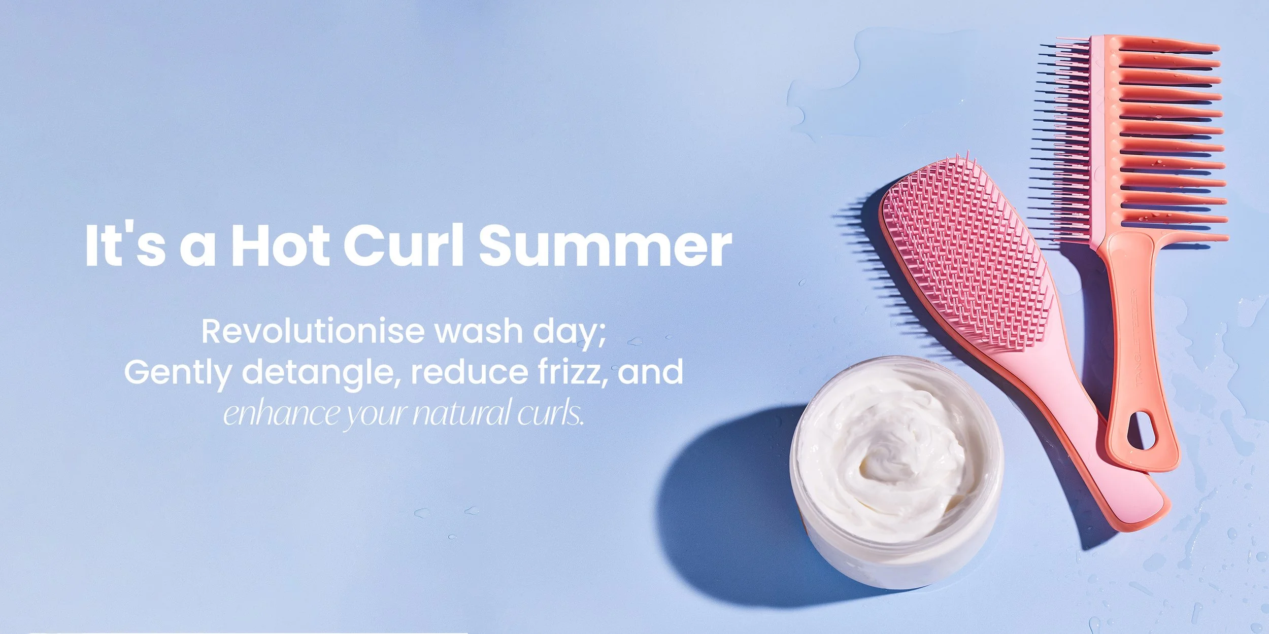 Text overlay on a blue background with pink hairbrush, wide-tooth comb, and a container of hair cream or conditioner. The text reads: "It's a Hot Curl Summer. Revolutionise wash day; Gently detangle, reduce frizz, and enhance your natural curls."