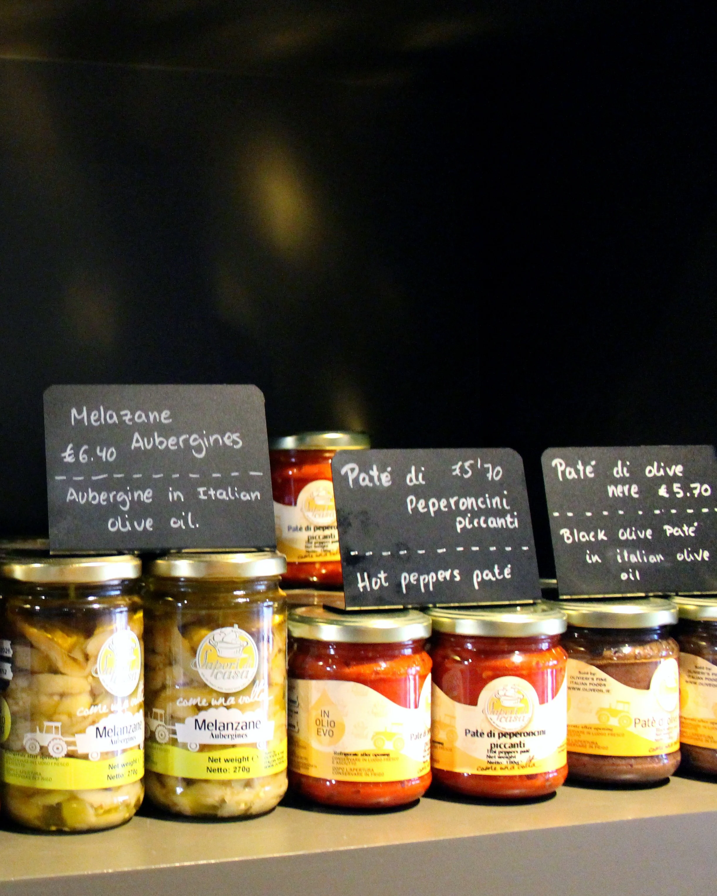 Selection of Italian deli jars and pâtés displayed on a shelf inside Sev7en café in Bray.