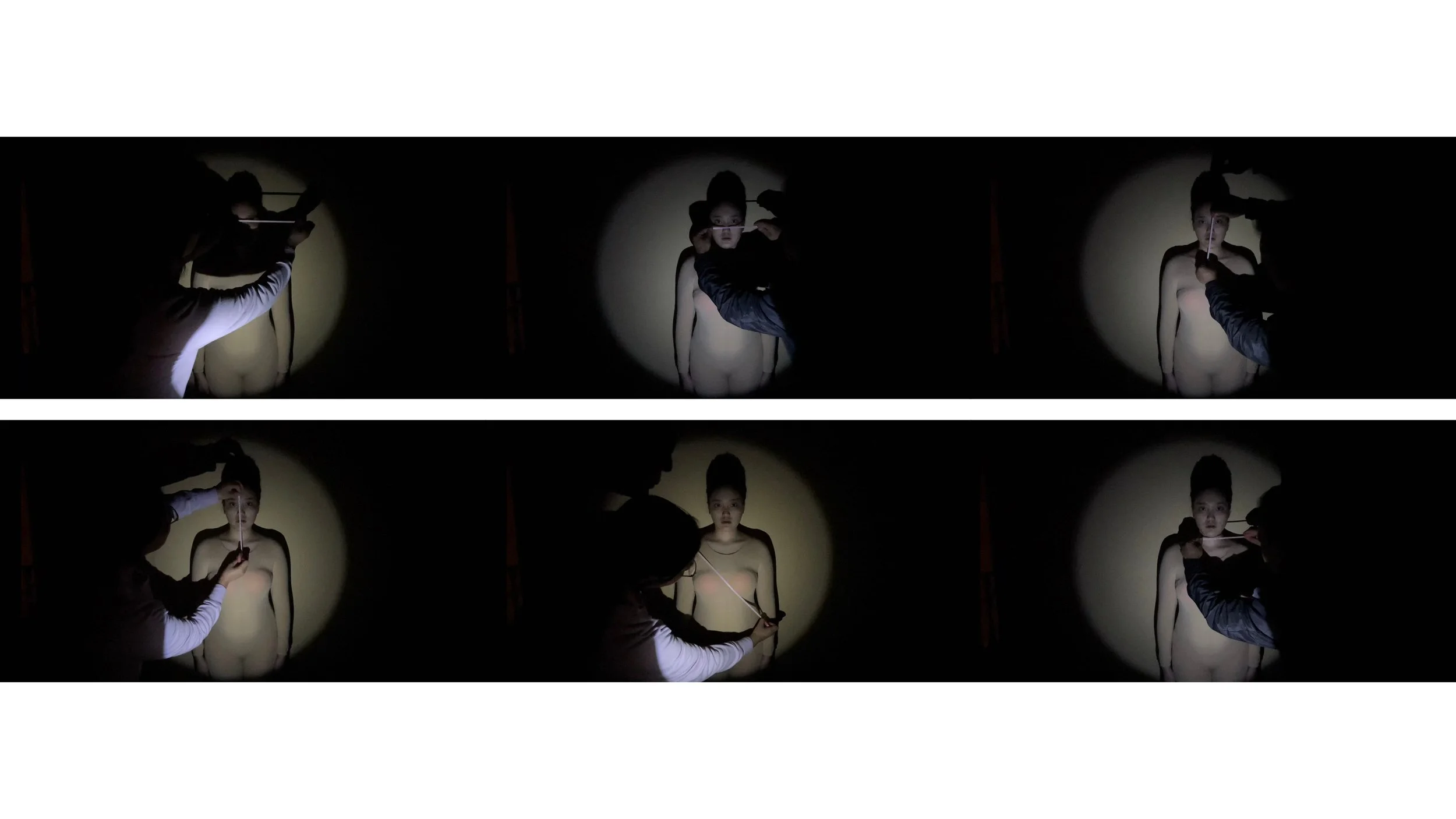 Two images of a model being painted or measured in front of a dark background with a spotlight, showing the process of applying makeup or special effects in a studio setting.