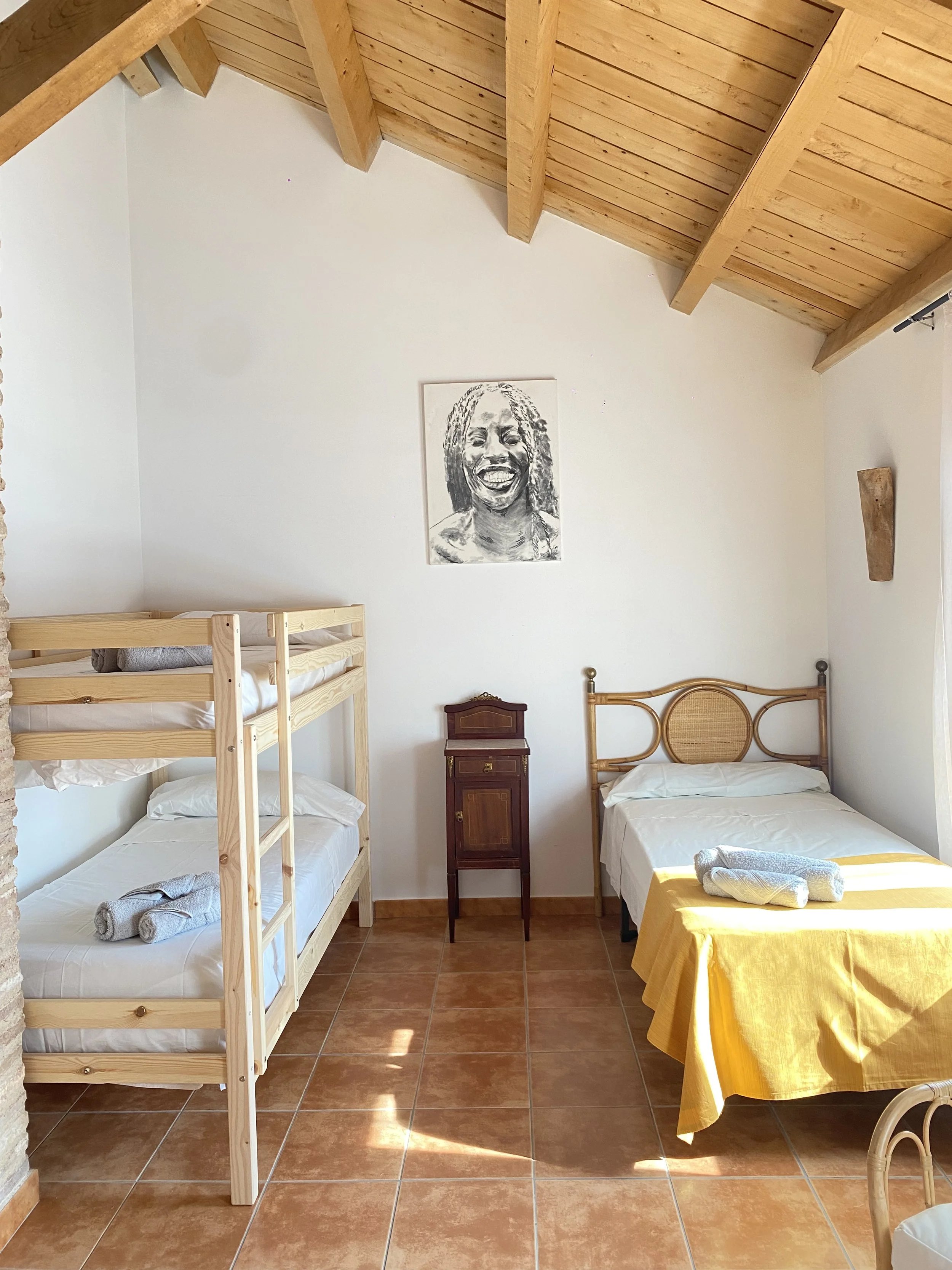 Habitación familiar con camas individuales y baño en suite