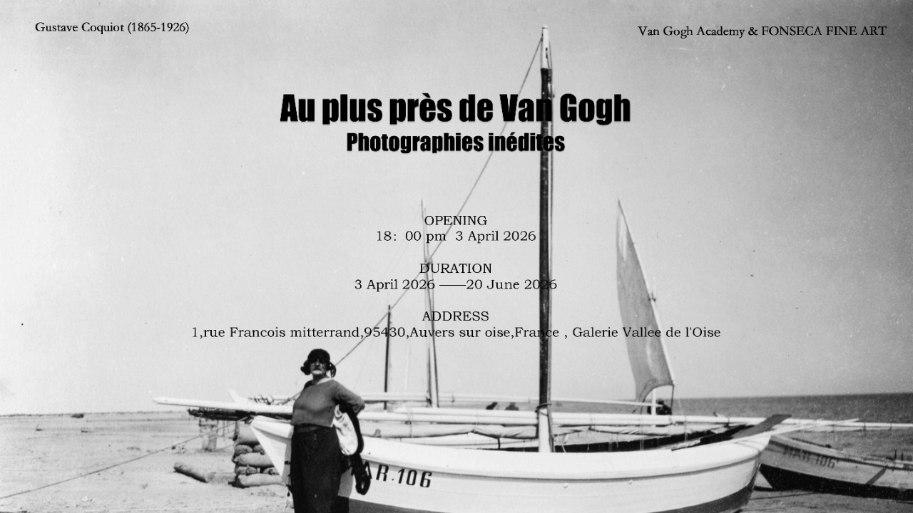 Black and white photograph of a woman standing on a beach next to a sailboat with sails up. The background shows a calm sea and the sky.