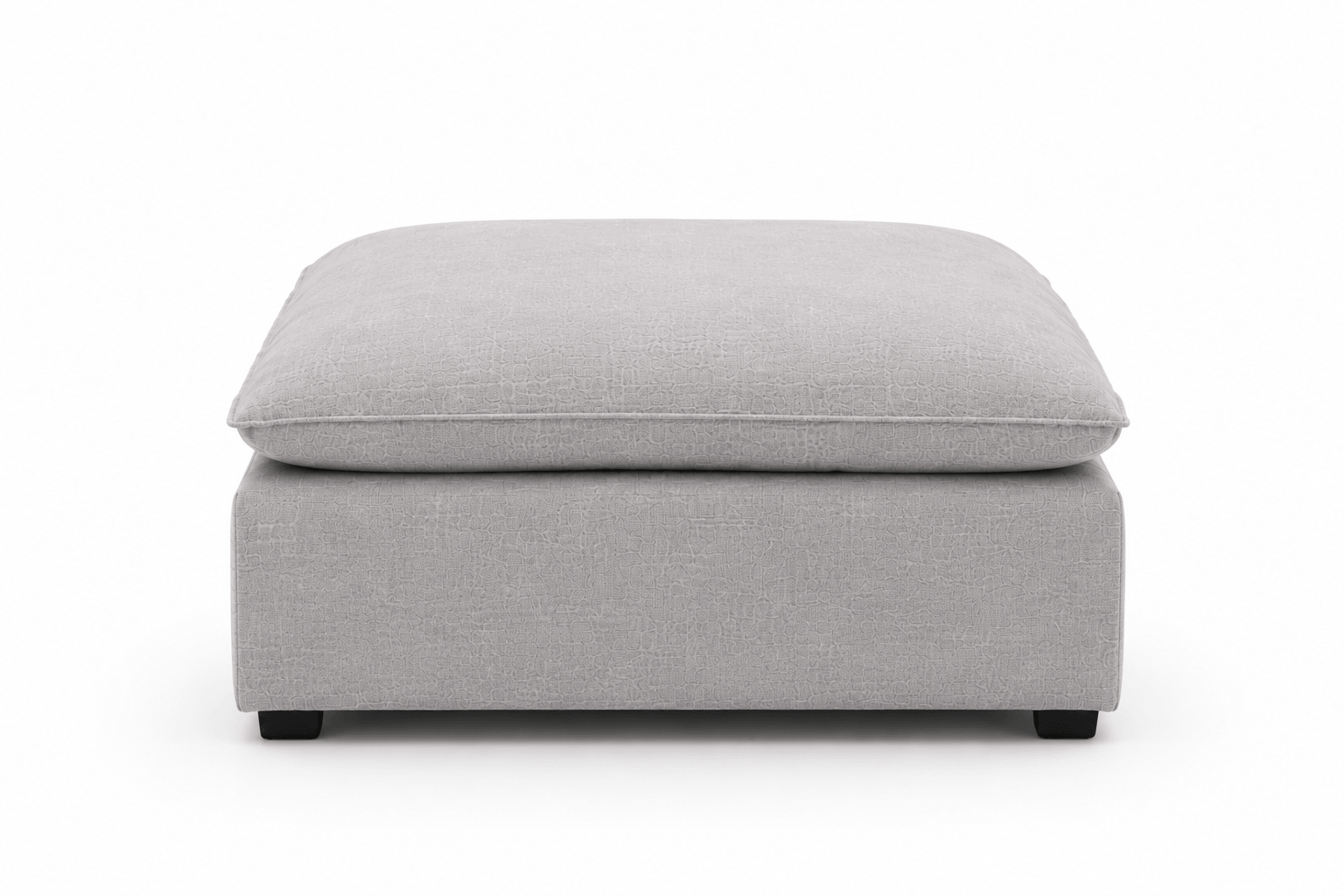 A light gray upholstered ottoman with a matching cushioned top against a plain white background.
