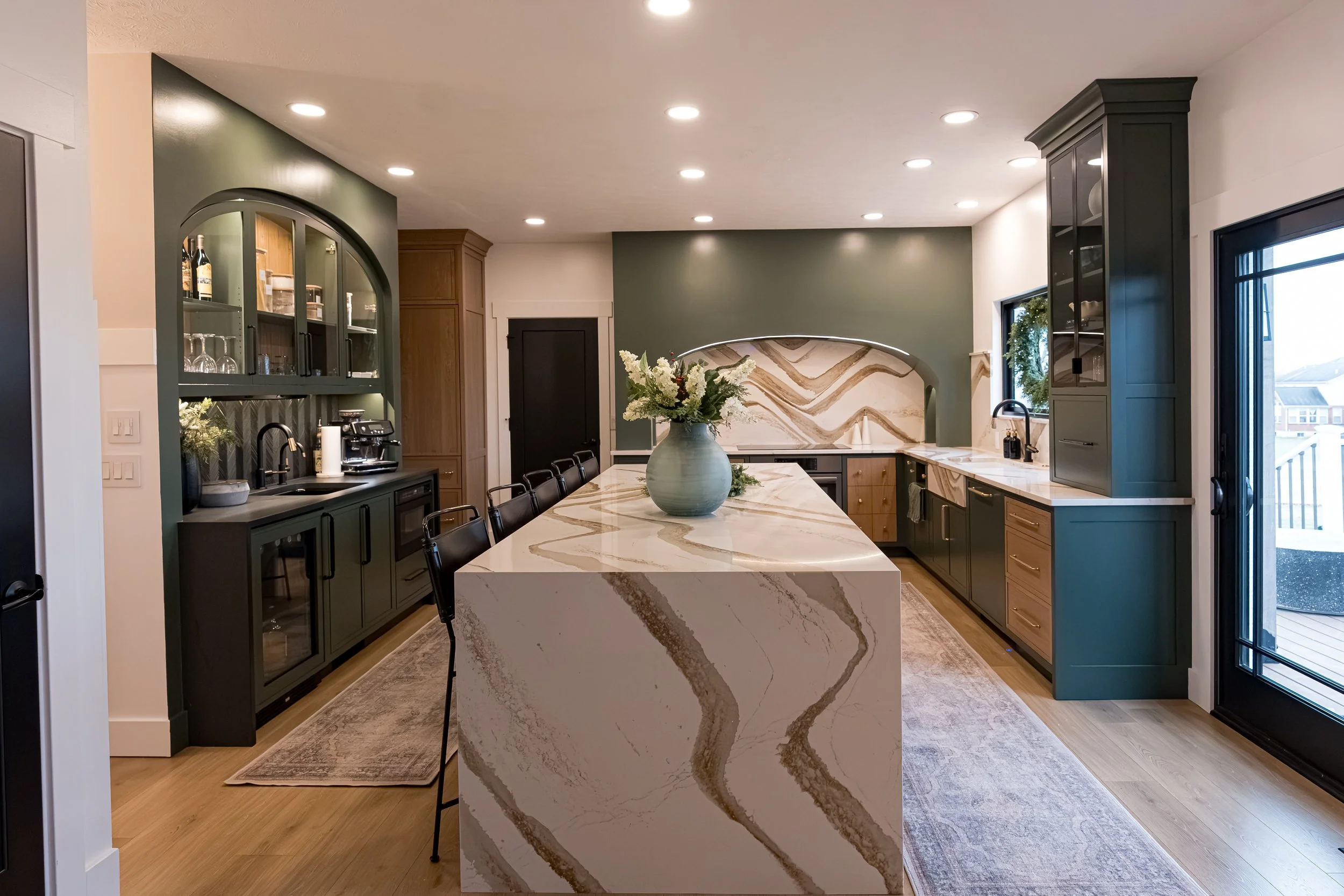 Beavercreek kitchen remodel with waterfall quartz island, sage green cabinets, and wood accents by White Oak Interiors