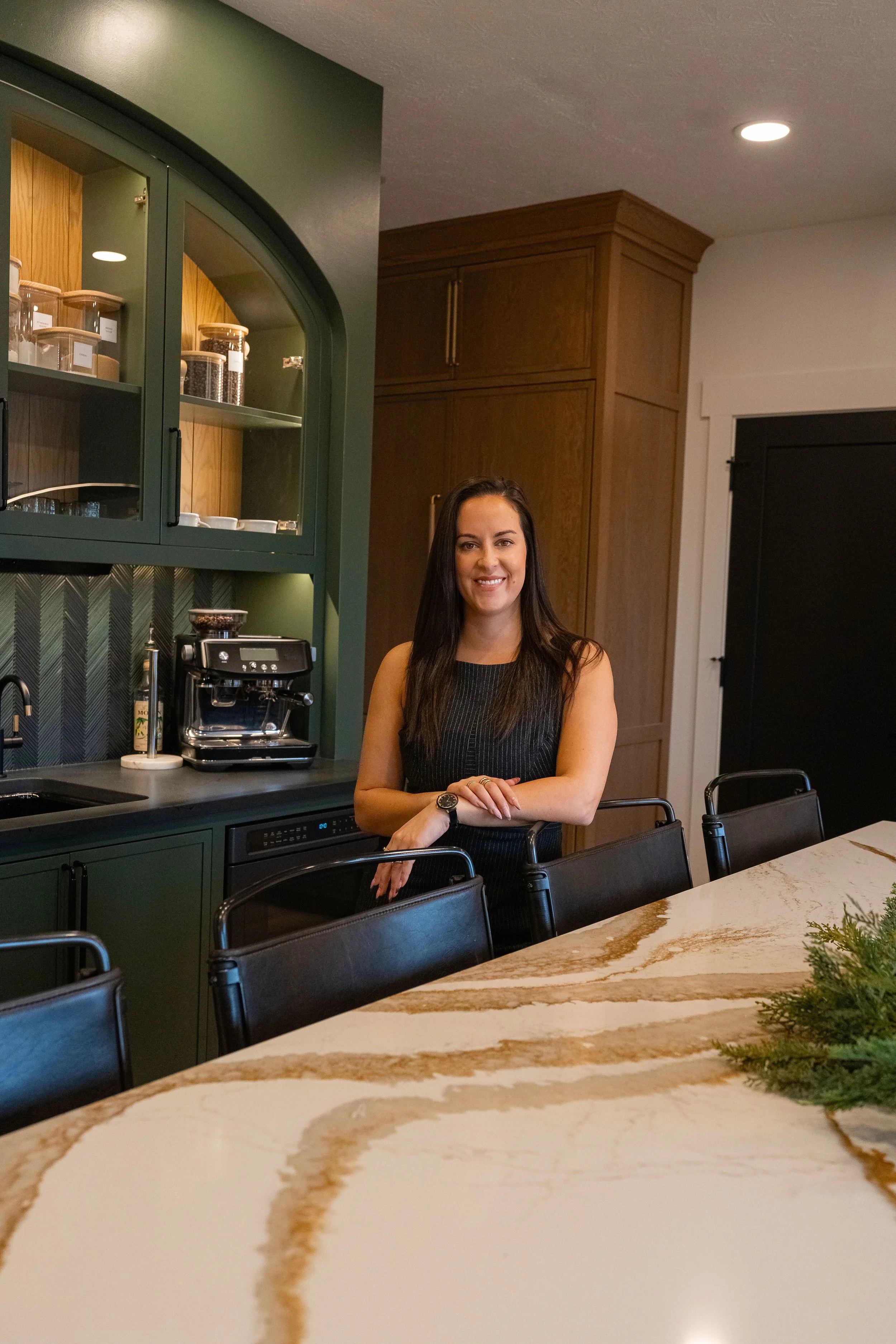 Madeline Bauman, owner and interior designer of White Oak Interiors, in a kitchen she designed near Dayton, Ohio