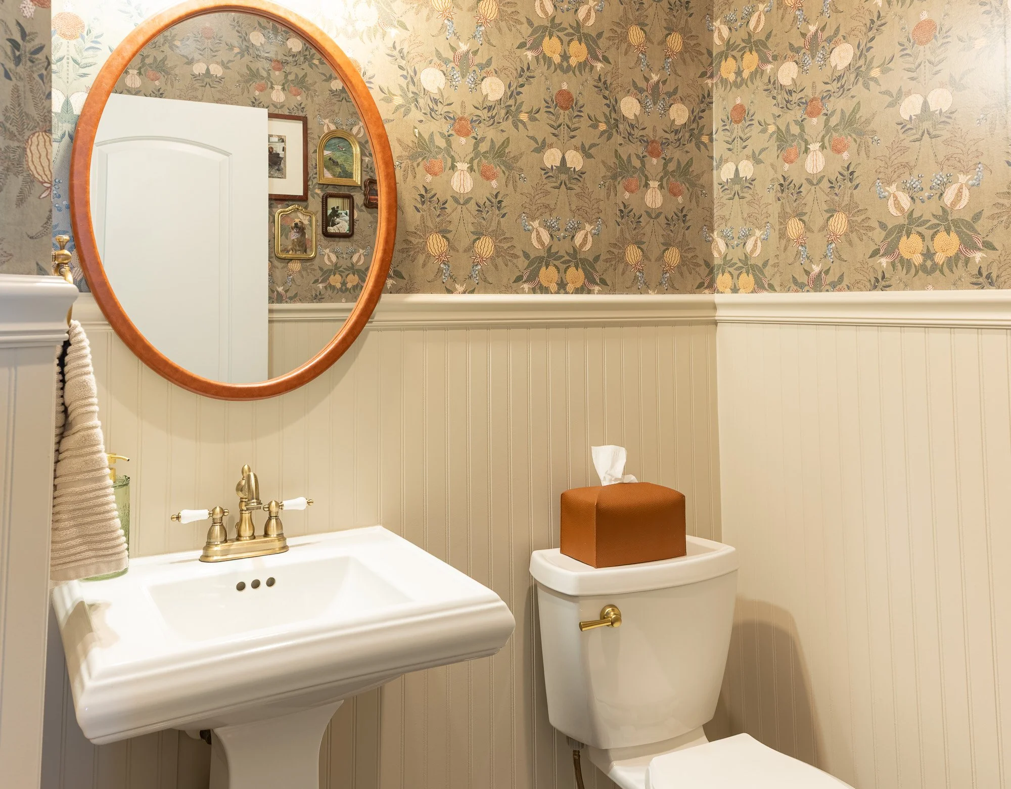 Half bath: Refreshed half bath with green painted trim and wallpaper in a Beavercreek, Ohio home