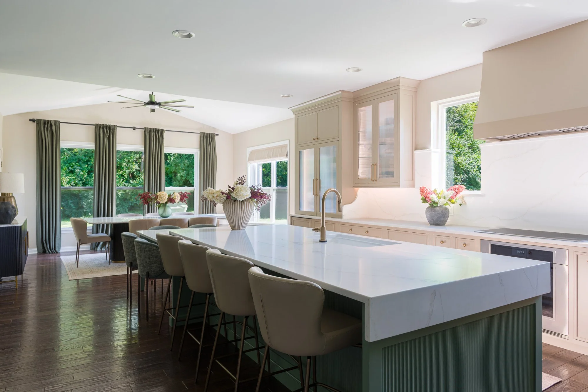 Coffee bar: Coffee bar with reeded glass pocket doors and wood shelving in a custom Beavercreek kitchen