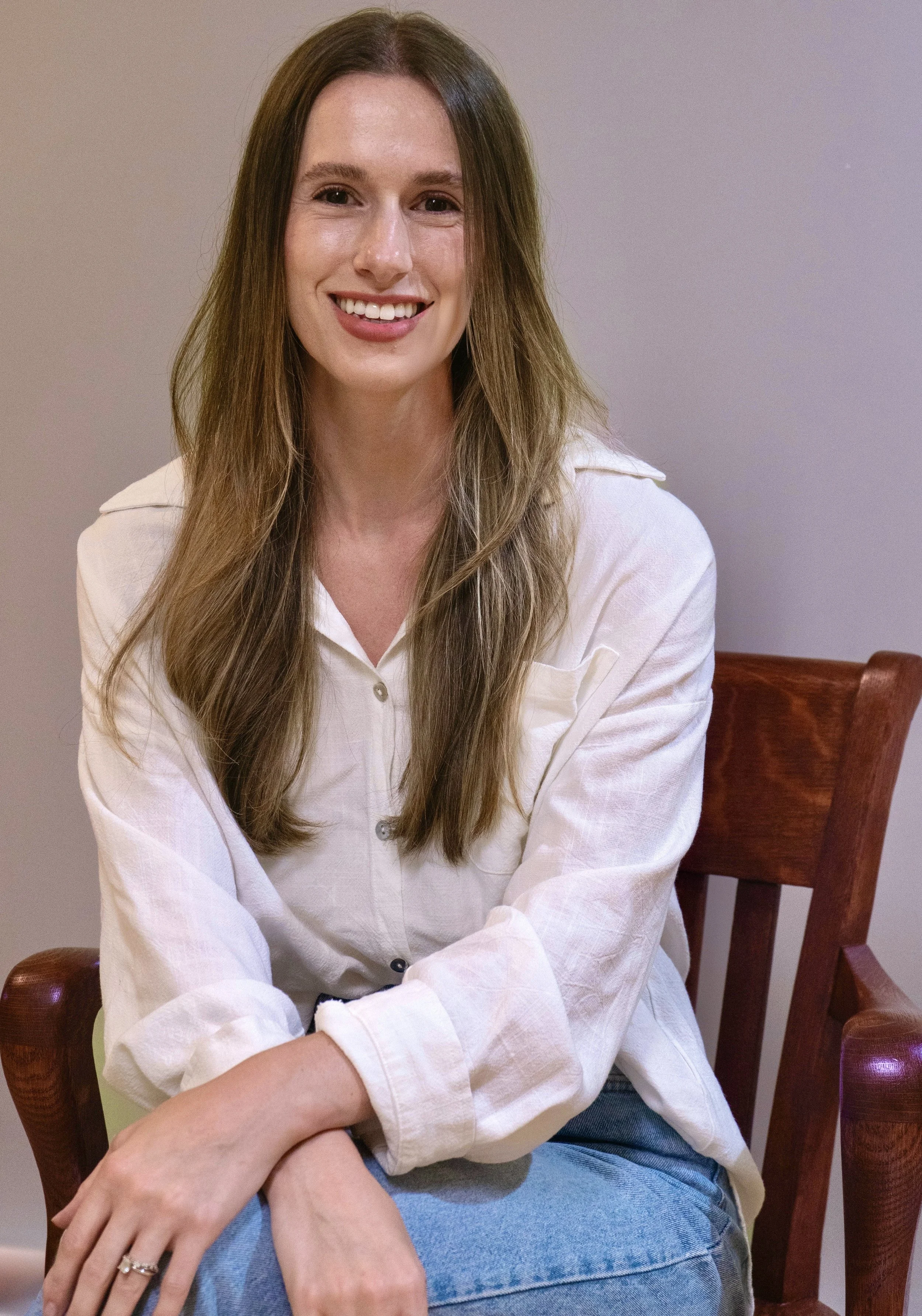 Therapist sitting with client in a calm office setting