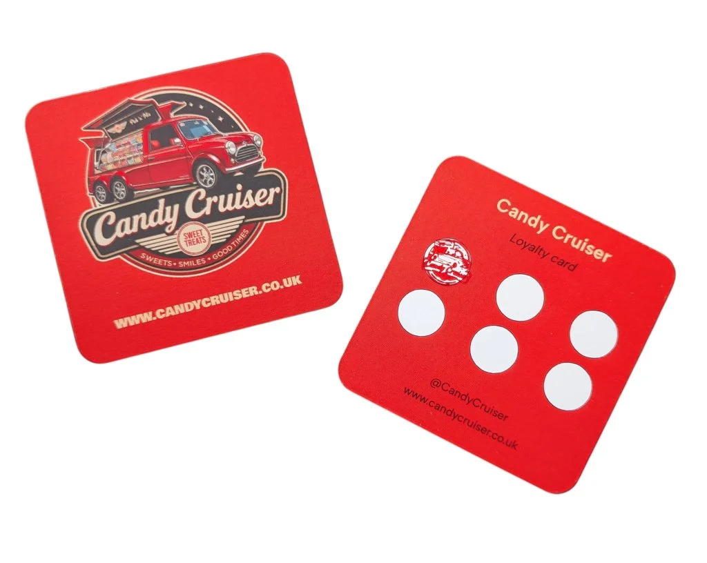 Two red Candy Cruiser loyalty cards, one displaying a logo of a vintage car, and the other showing six white circles for stamping, with website and social media details.