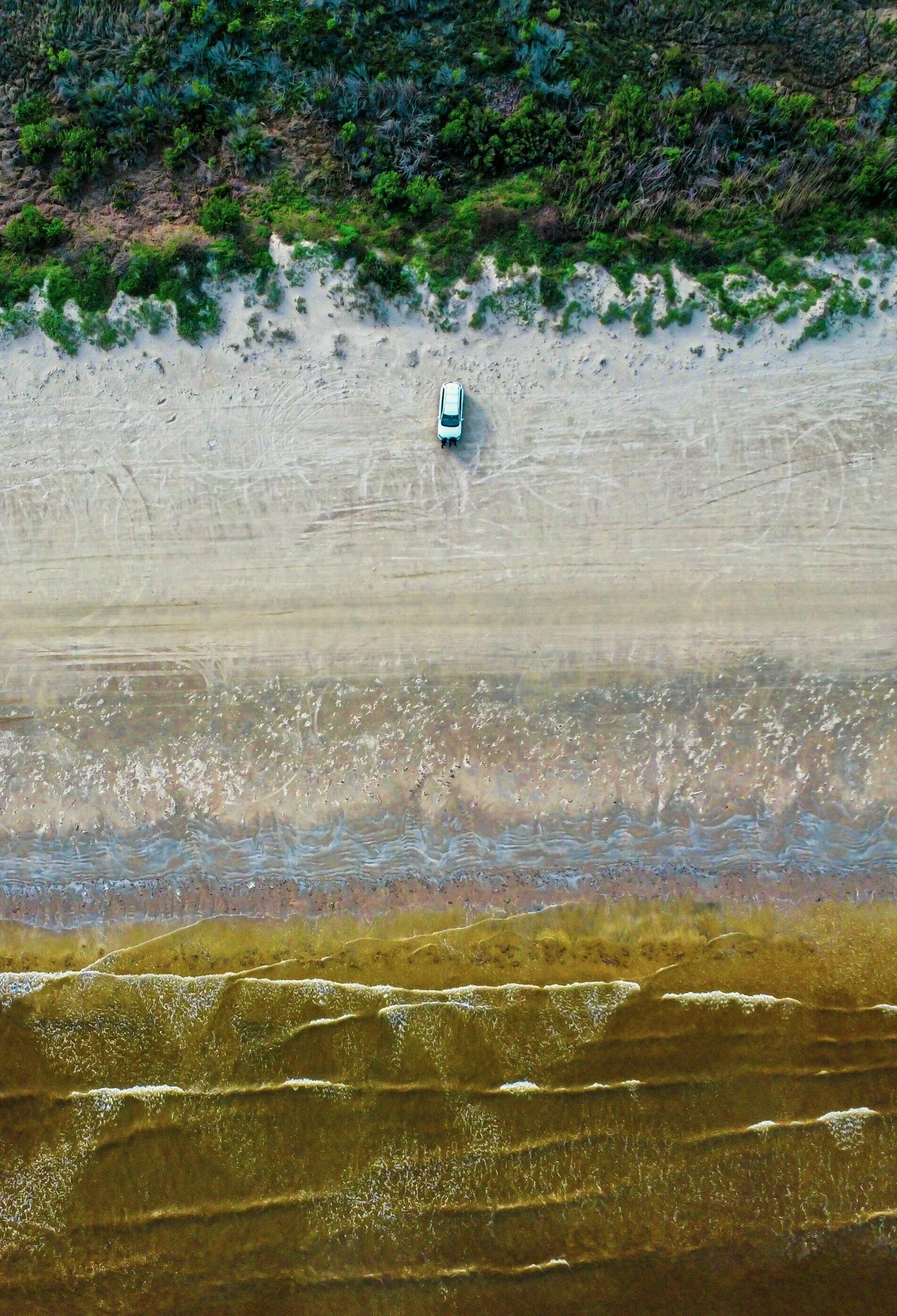 Overhead view of Jeep on Massachusetts beach