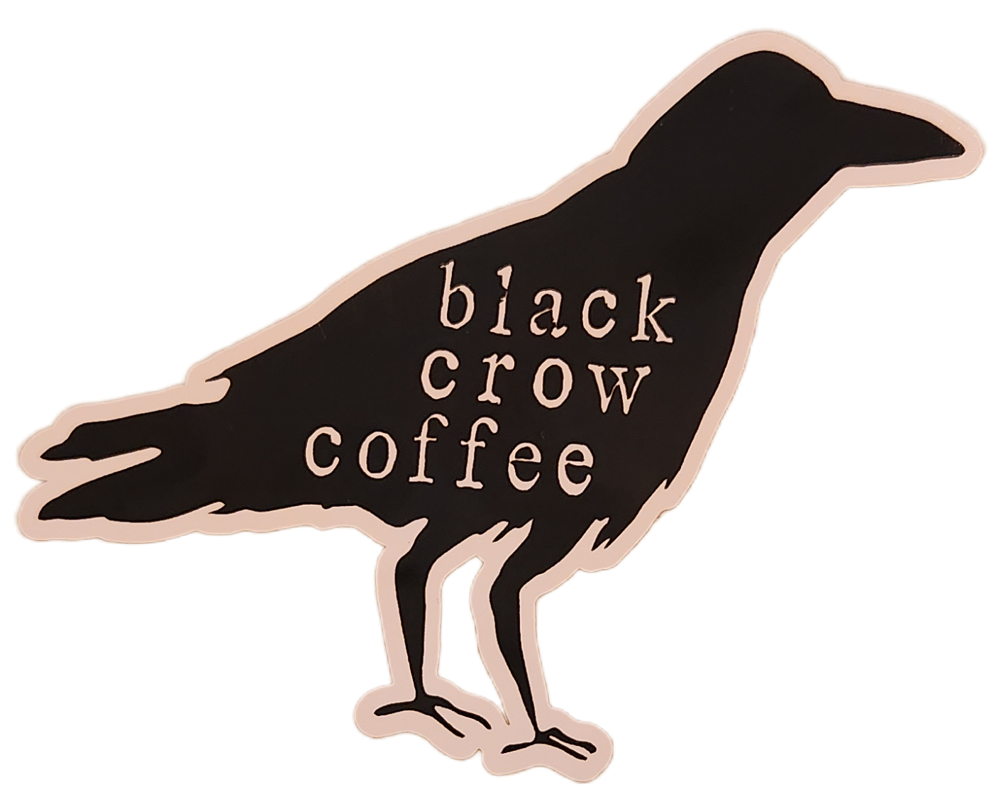 A black crow-shaped sticker with the words 'black crow coffee' in lowercase letters inside the silhouette of the bird.