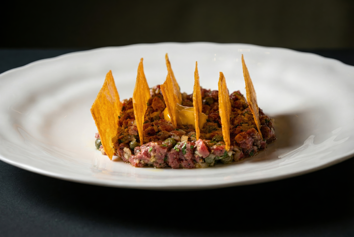 tartare with vertically placed strips of tortilla