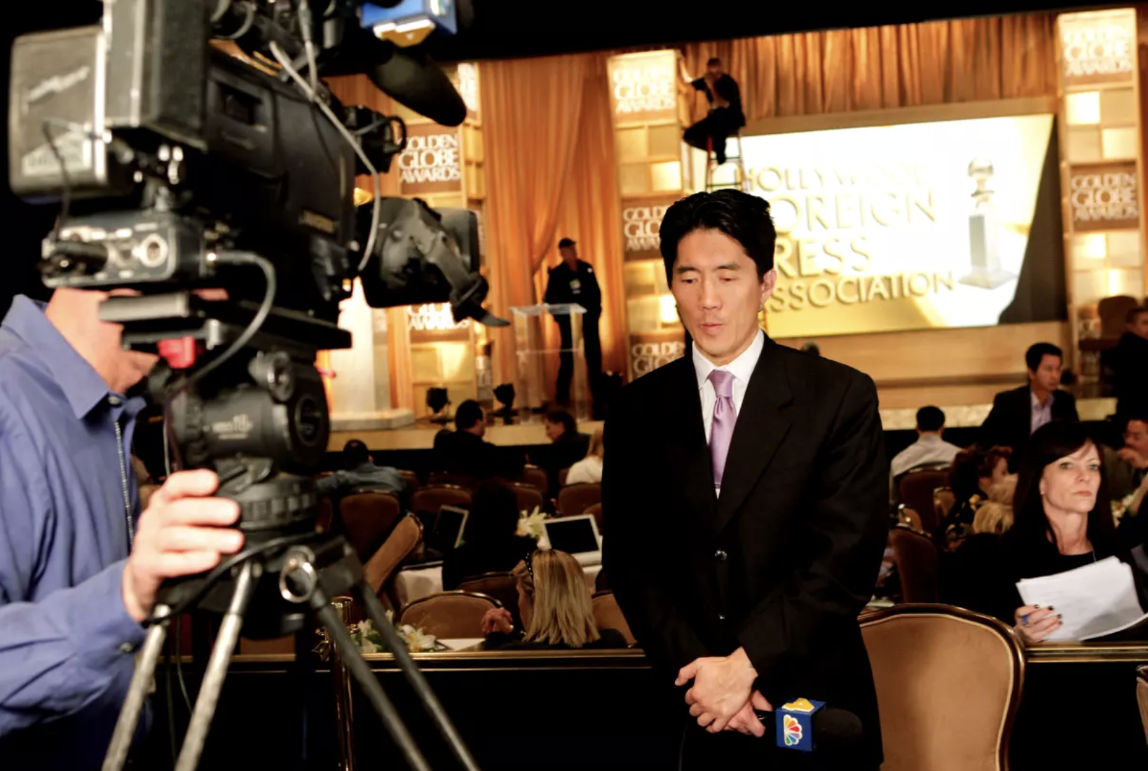 Ted Chen in front of a camera.