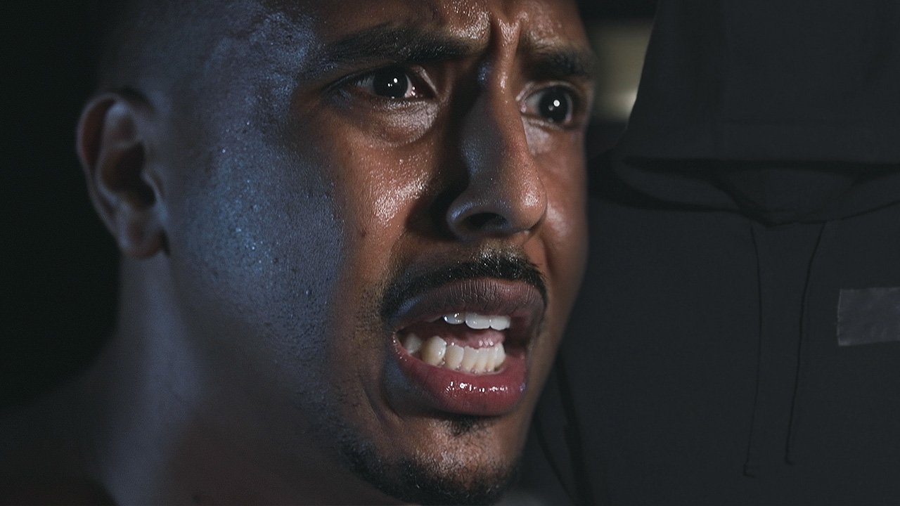 Close-up of a man's face showing distress or fear, with sweat on his skin and an intense expression. BoldVision Studios