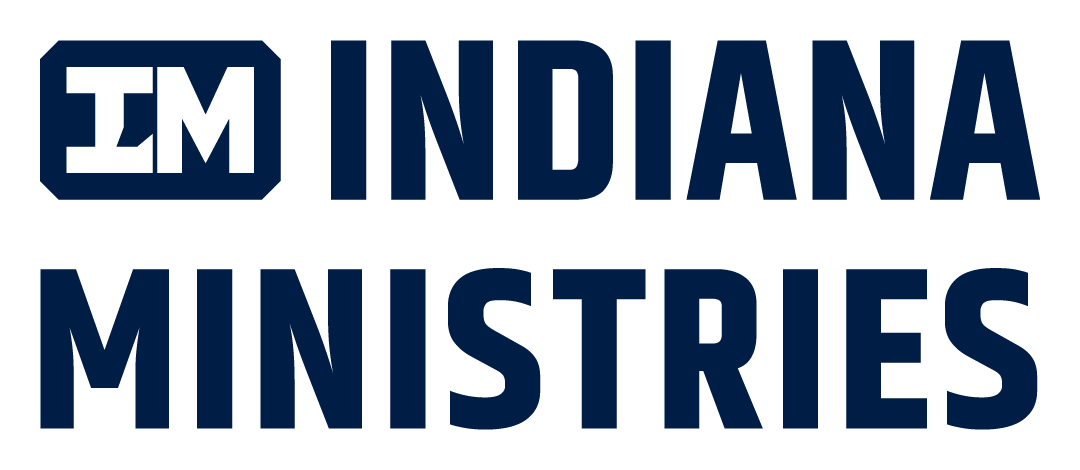 Logo with the text '97.3 FM INDIANA MINISTRIES' in dark blue, with a small 'FM' inside a rounded square to the left.