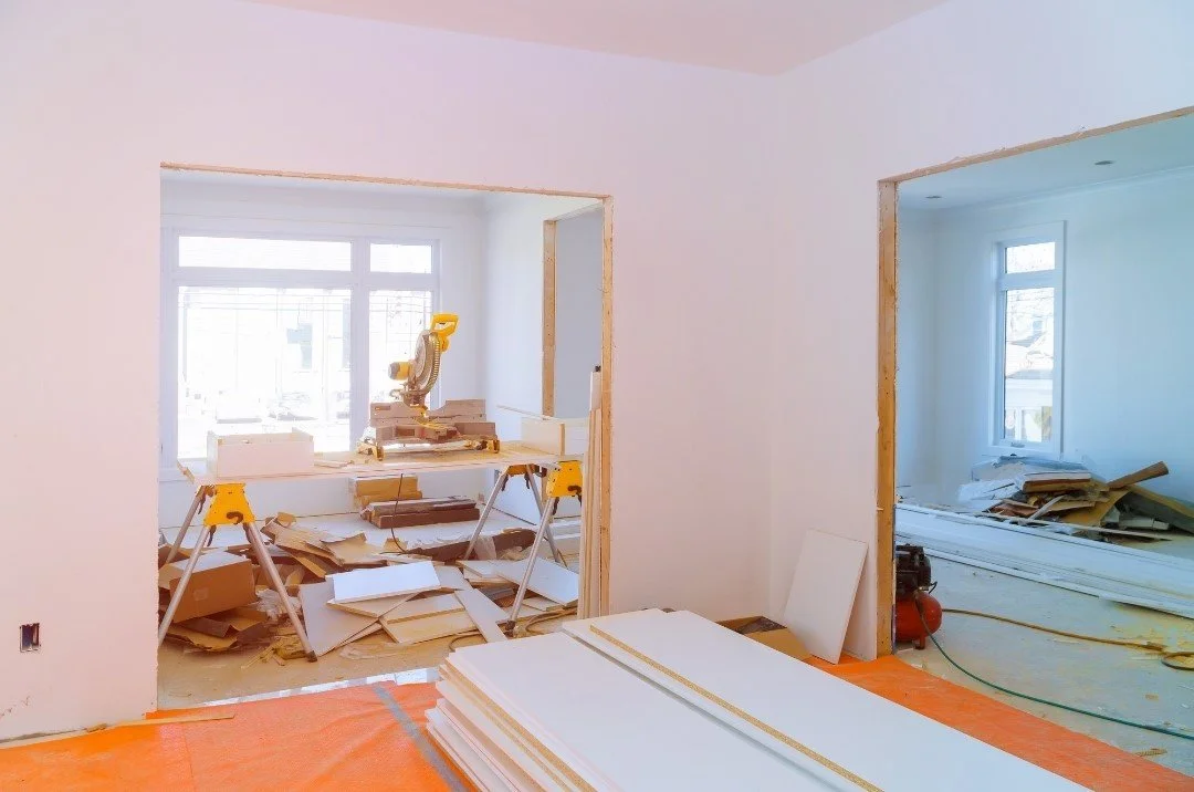 New home construction site showing the building process from framing to completion, representing the typical timeline and stages involved in building a custom home.