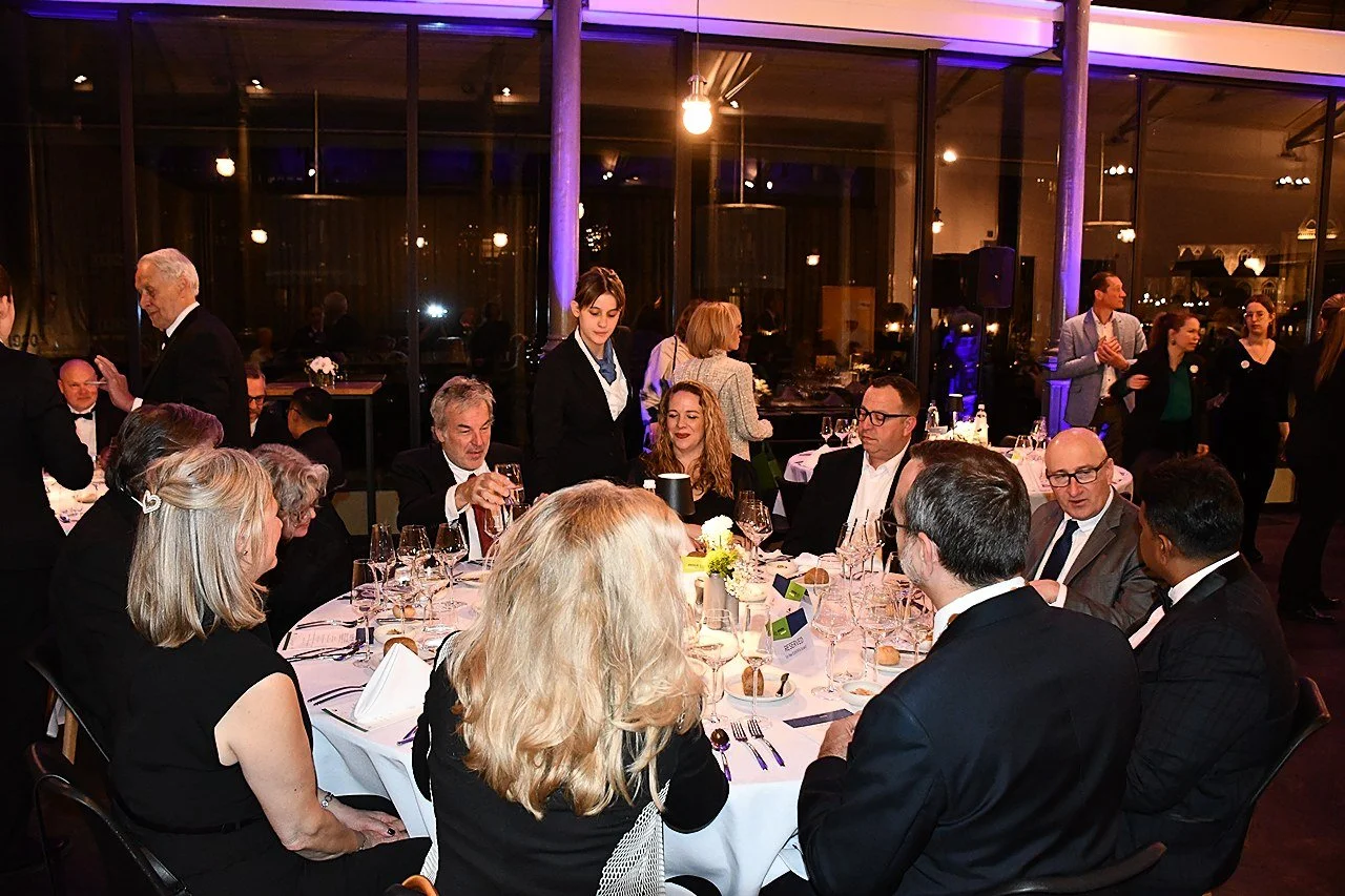 Members sit around a table at the gala dinner during EUHOFA Congress.