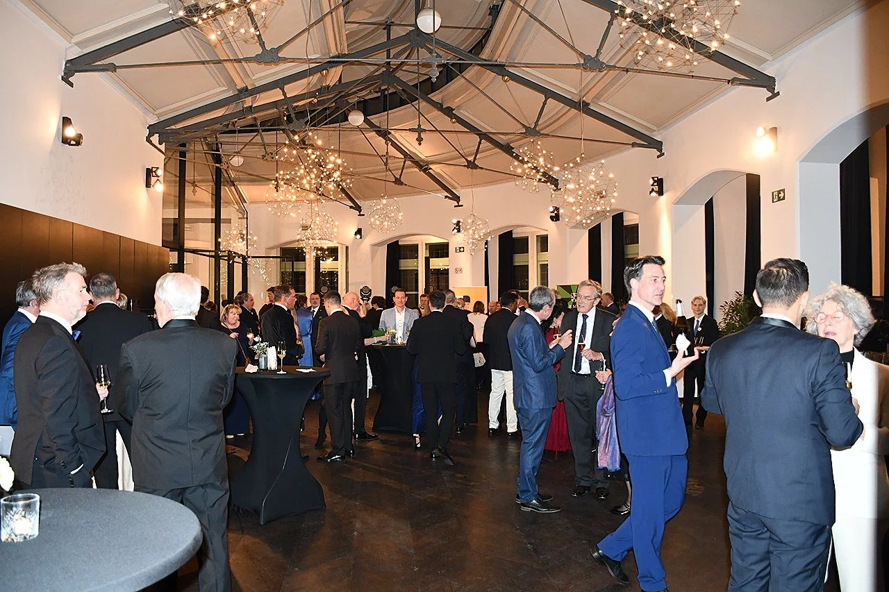 A large group of members at a formal gathering in an elegant venue during EUHOFA Congress.