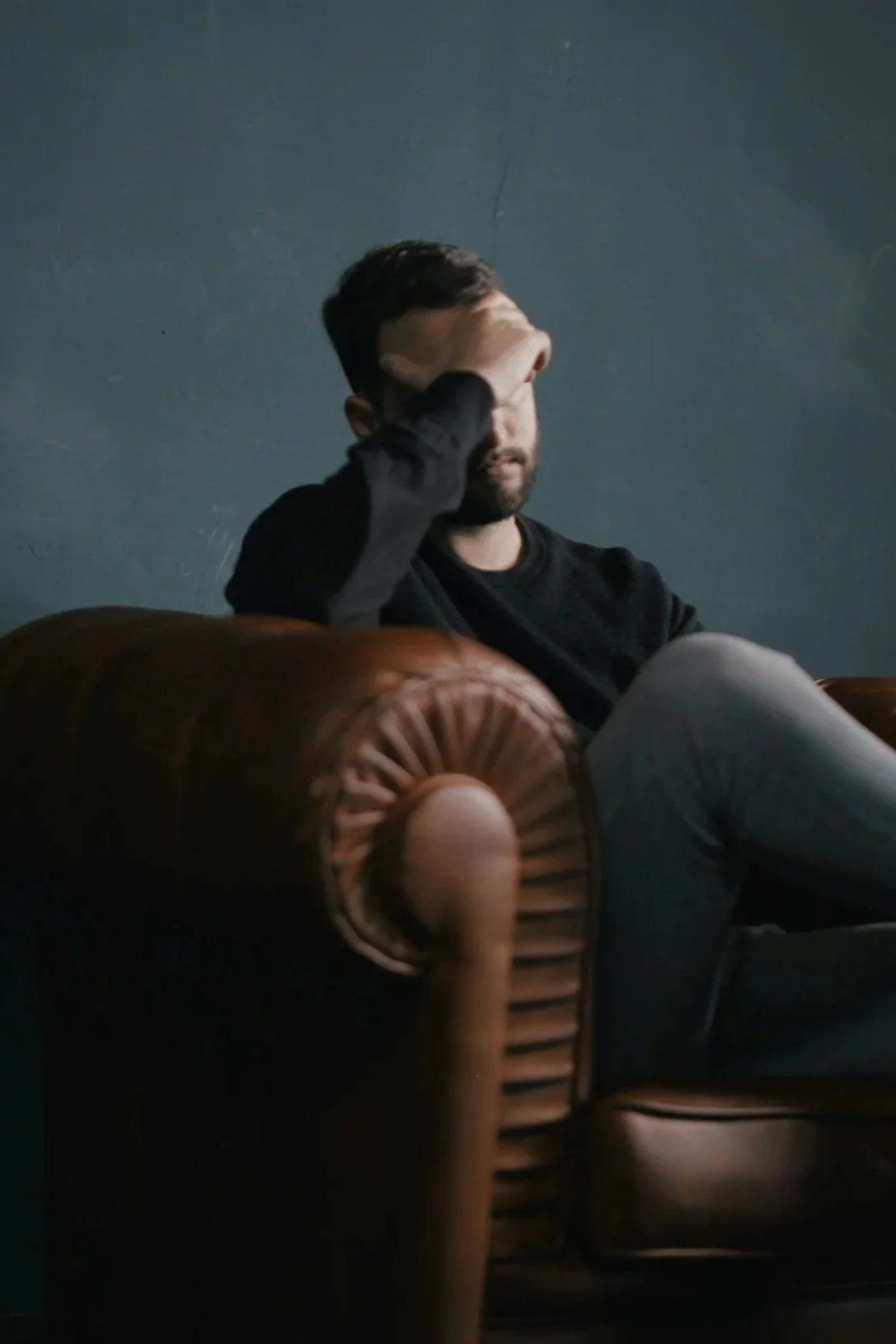 Sad man on a couch
