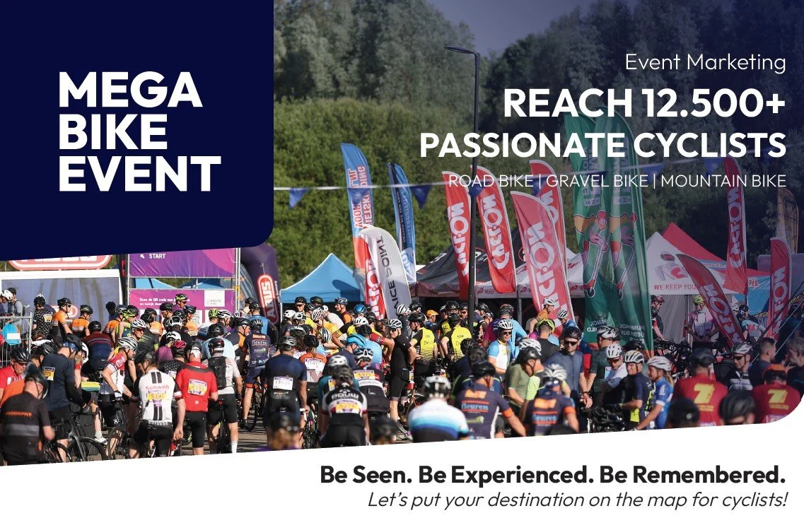 Crowd of cyclists at a bike event with flags and tents, promoting a Mega Bike Event for passionate cyclists.